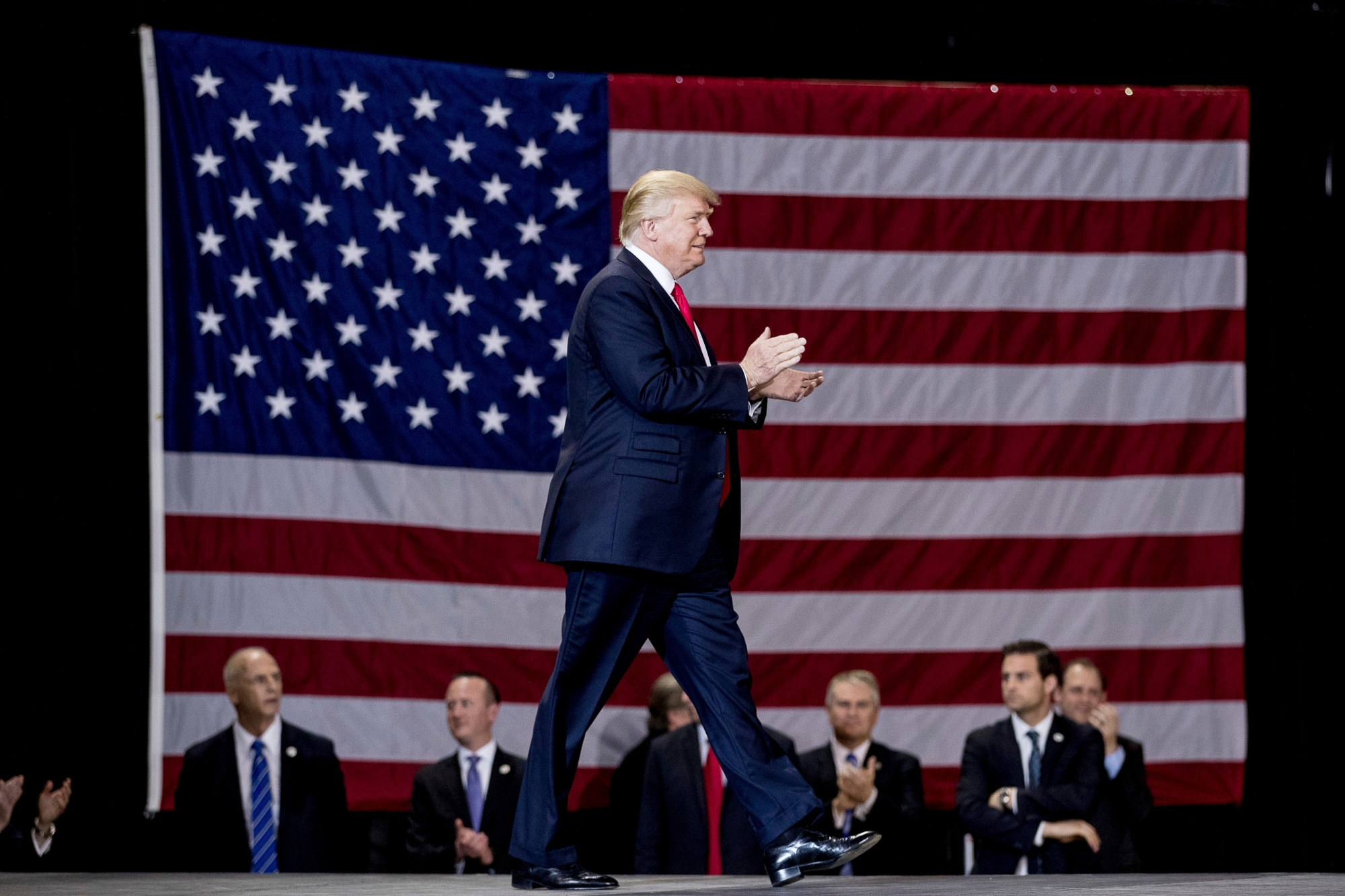DAY 60 - In this March 20, 2017, file photo, President Donald Trump arrives to speak at a rally at the Kentucky Exposition Center in Louisville, Ky. (AP Photo/Andrew Harnik, File) Trump 100 - 100 Photos
