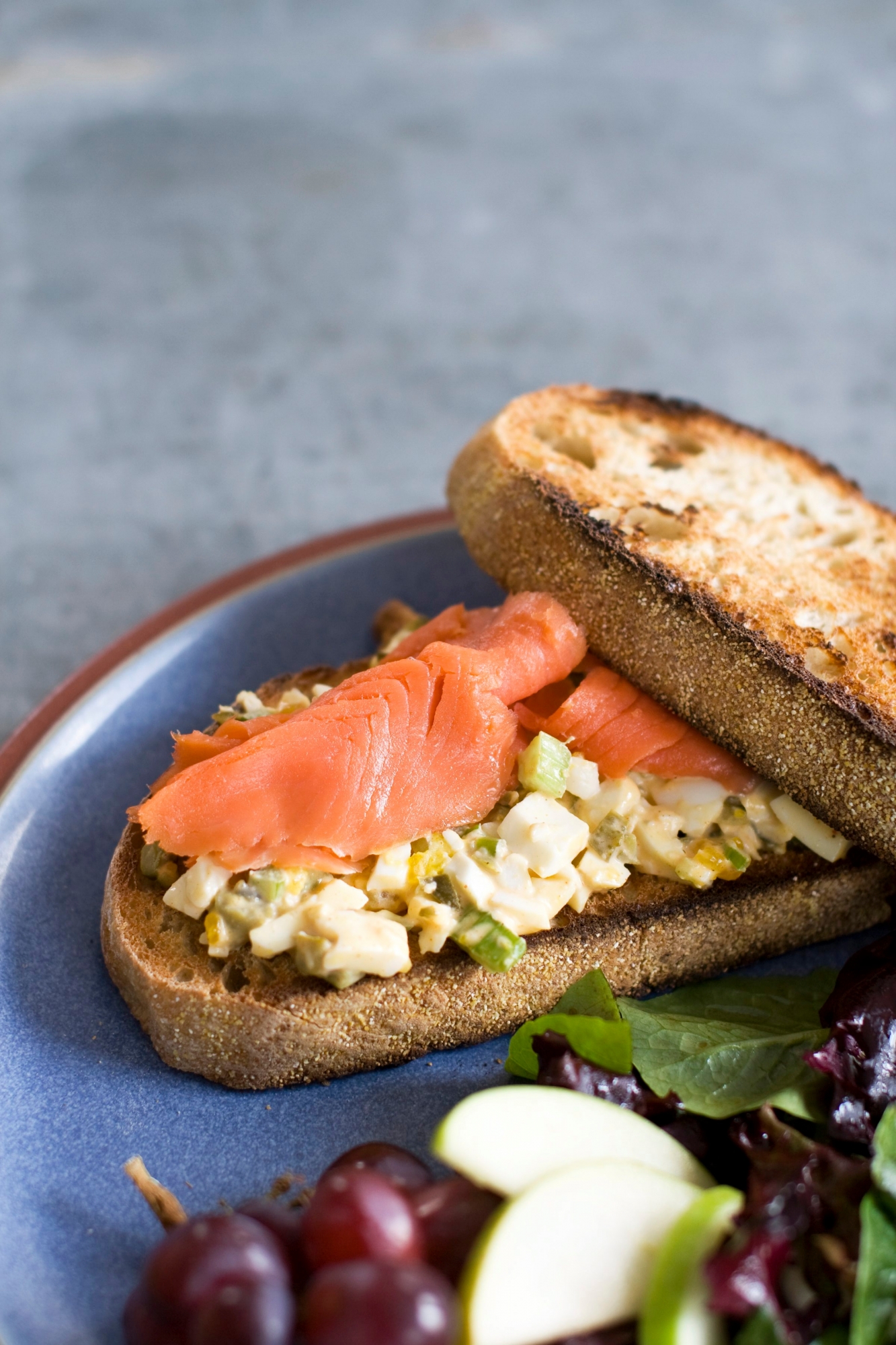 In this image taken on April 1, 2013, an egg salad sandwich with smoked salmon is shown served on a plate in Concord, N.H. (AP Photo/Matthew Mead) Food-Deadline-Egg Salad Sandwich