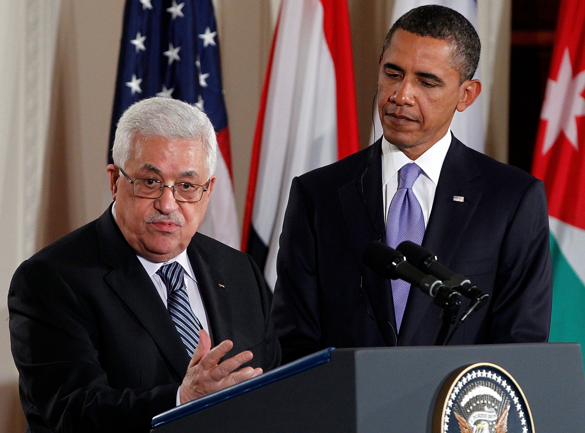 Palestinian President Mahmoud Abbas speaks on the Middle East peace negotiations in the East Room of the White House in Washington as President Barack Obama listens, Wednesday, Sept. 1, 2010. (AP Photo/Charles Dharapak) Obama US  Mideast Talks