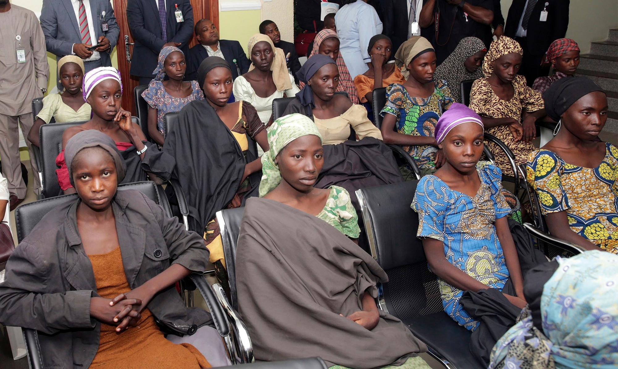 FILE - In this Thursday, Oct. 13, 2016 file photo released by the Nigeria State House, Chibok schoolgirls recently freed from Islamic extremist captivity are seen during a meeting with Nigeria's Vice President Yemi Osinbajo in Abuja, Nigeria. Large numbers of Chibok schoolgirls seized three years ago by Boko Haram have been freed in exchange for detained suspects with the extremist group, Nigeria's government announced early Sunday, May 7, 2017 in the largest release negotiated yet in the battle to save nearly 300 girls whose mass abduction exposed the mounting threat posed by the Islamic State-linked fighters. After the initial release of 21 Chibok girls in October, the government denied making an exchange or paying ransom. (Sunday Aghaeze/Nigeria State House via AP, File) Nigeria Kidnapped Schoolgirls
