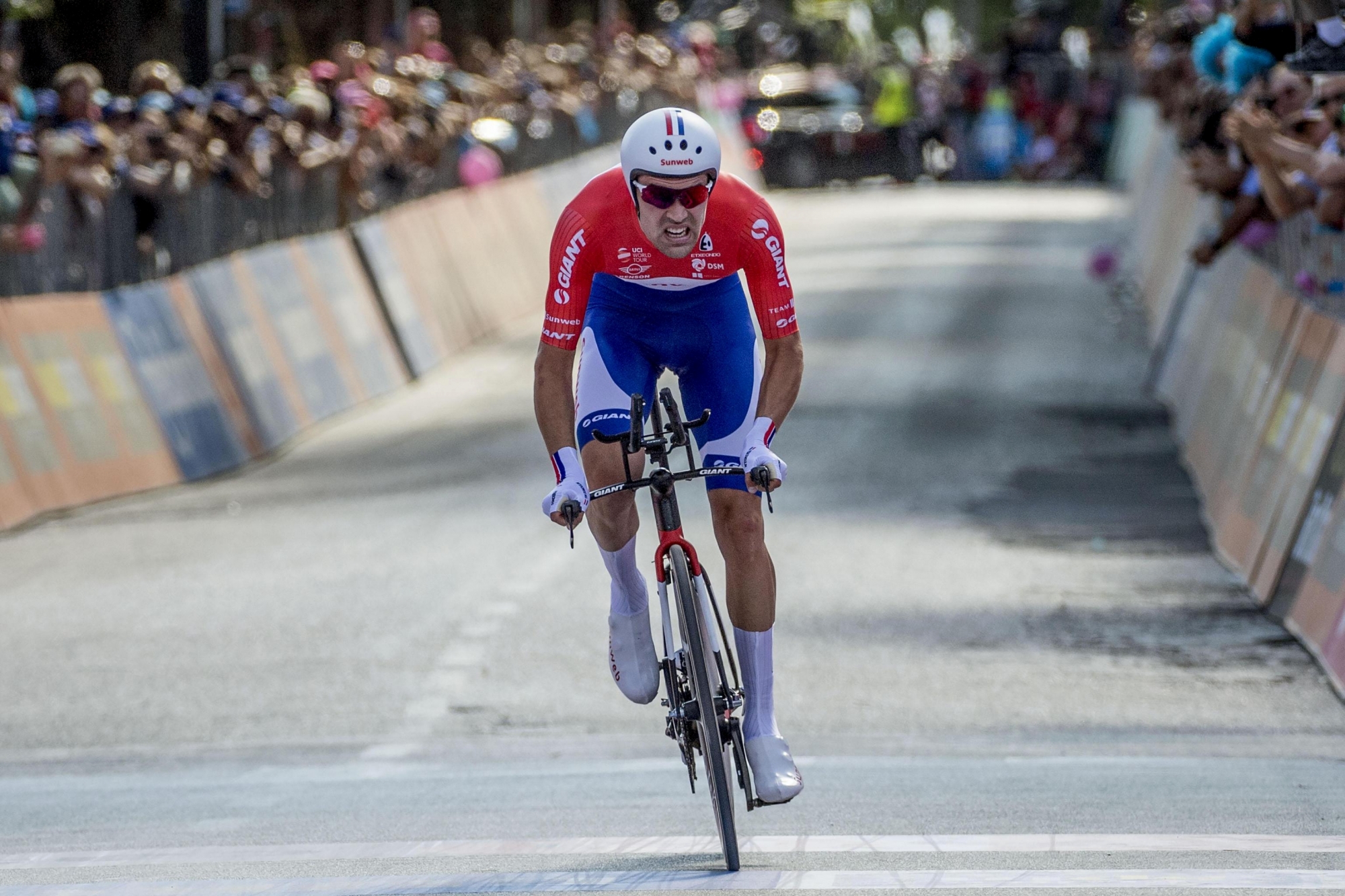 Tom Dumoulin approaches the finish line on his way to win the 10th stage of the Giro d'Italia, Tour of Italy cycling race, an individual time trial from Foligno to Montefalco, Tuesday, May 16, 2017.  Dutch rider Tom Dumoulin has dominated an individual time trial through Umbria's winemaking region to take the overall leader's pink jersey after the 10th stage of the Giro d'Italia. (Alessandro Di Meo/ANSA via AP) Italy Giro Cycling