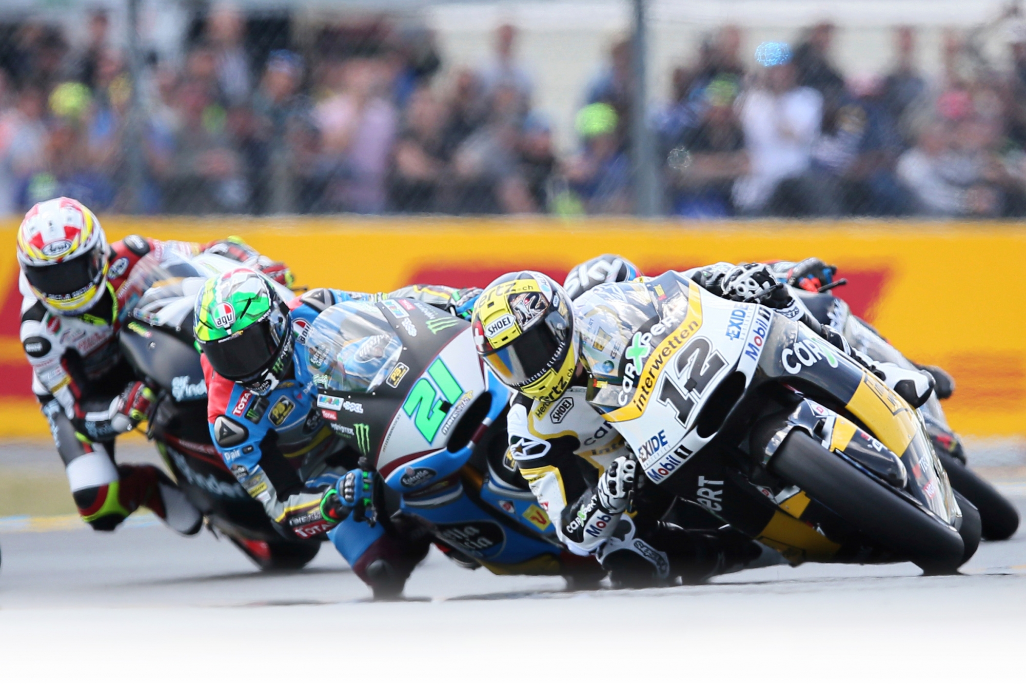 Moto2 rider Thomas Luethi of Switzerland, right, and Moto2 rider Franco Morbidelli of Italy, center, competes during the French Grand Prix's race, in Le Mans, western France, Sunday, May 21, 2017. (AP Photo/David Vincent) France GP Motorcycle Racing
