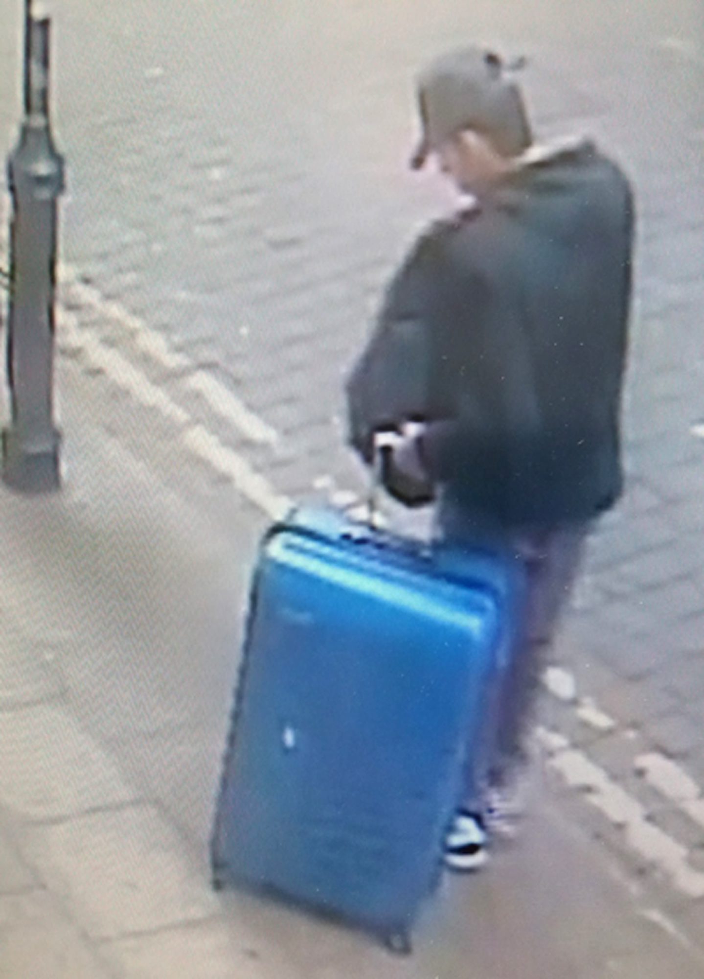 This is a handout photo taken on Monday, May 22, 2017 from CCTV and issued on Monday, May 29, 2017 by Greater Manchester Police of Salman Abedi in an unknown location of the city centre in Manchester, England. The police released an image of the bomber carrying a distinctive blue suitcase and an image of a replica of the case as they appealed for information about his final days. (Greater Manchester Police via AP) Britain Concert Blast