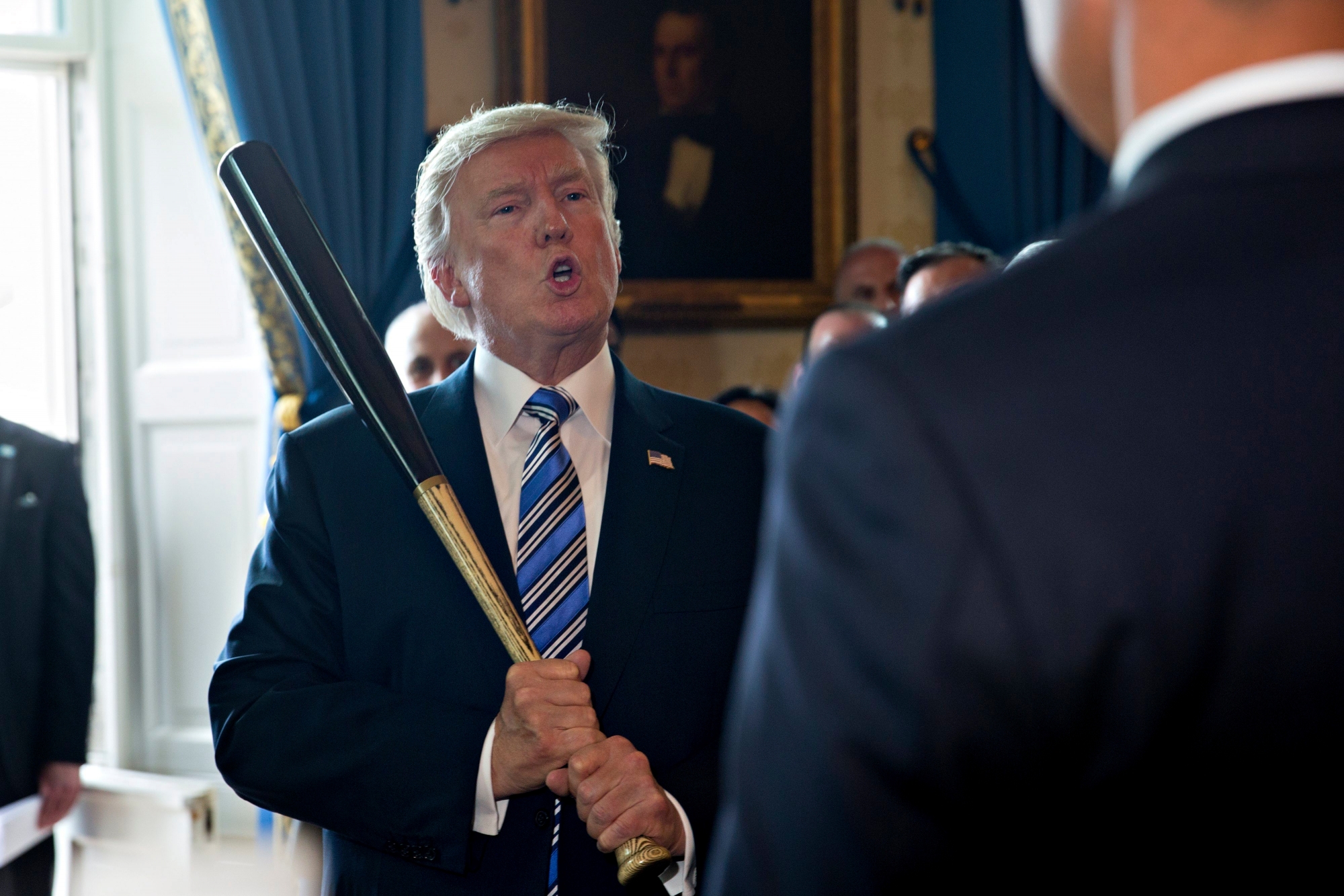 epa06093584 US President Donald J. Trump holds a baseball bat while participating in a Made in America event with companies from 50 states featuring their products in the Blue Room of the White House in Washington, DC, USA, 17 July 2017. US President Donald J. Trump participated at the White House in a showcase of products 'Made in America', which featured 50 products from the 50 states of the nation. Trump signed a presidential proclamation in the East Room making 17 July 'Made in America' Day and this week, 'Made in America' week.  EPA/Andrew Harrer / POOL USA TRUMP WHITE HOUSE MADE IN AMERICA