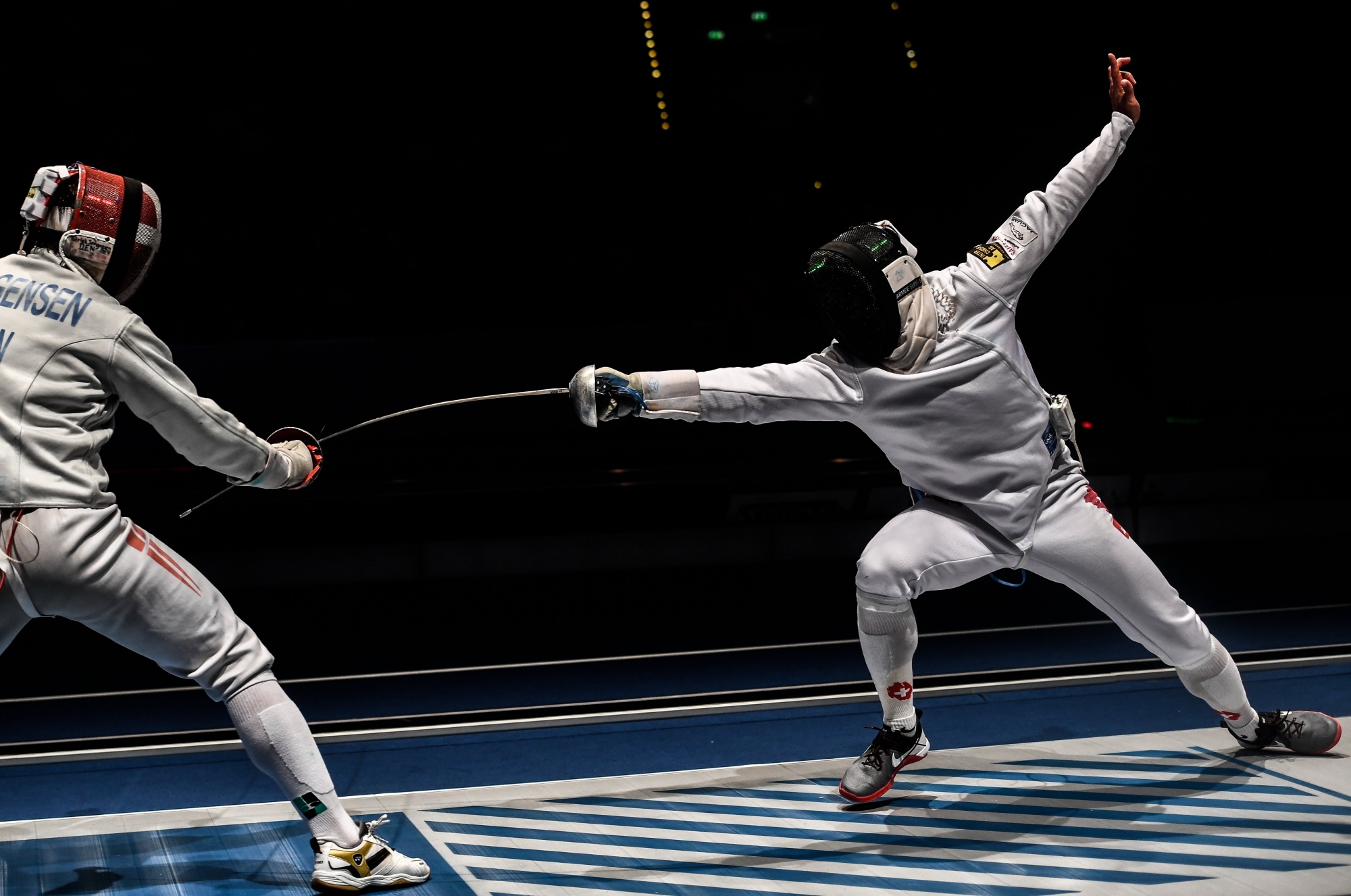 epa06103193 Switzerland's Max Heinzer (R) competes against Patrick Jorgensen of Denmark in a men's Epee qualifying bout at the Fencing World Championships in Leipzig, Germany, 22 July 2017.  EPA/FILIP SINGER GERMANY FENCING WORLD CHAMPIONSHIPS 2017
