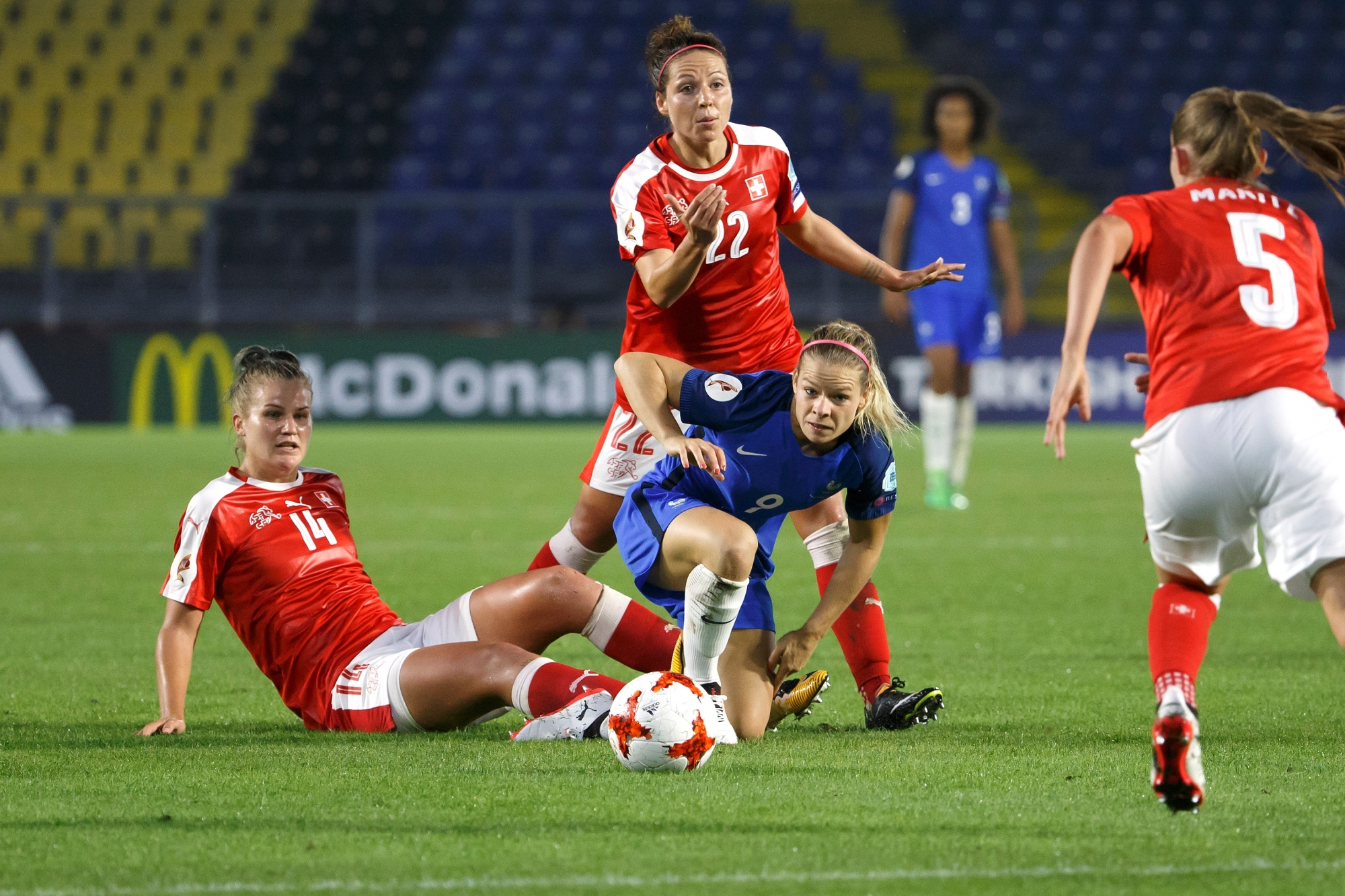 CAPTION CORRECTION: CORRECTS NAME - France's midfielder Eugenie Le Sommer, 2nd right, fights for the ball with Switzerland's players defender Rahel Kiwic, left, midfielder Vanessa Bernauer, center, and defender Noelle Maritz, right, during the UEFA Women's Euro 2017 group C preliminary round match between Switzerland and France, at the Rat Verlegh stadium, in Breda, The Netherlands, Wednesday, July 26, 2017. (KEYSTONE/Salvatore Di Nolfi) NETHERLANDS SOCCER WOMEN UEFA EURO 2017 CHE FRA