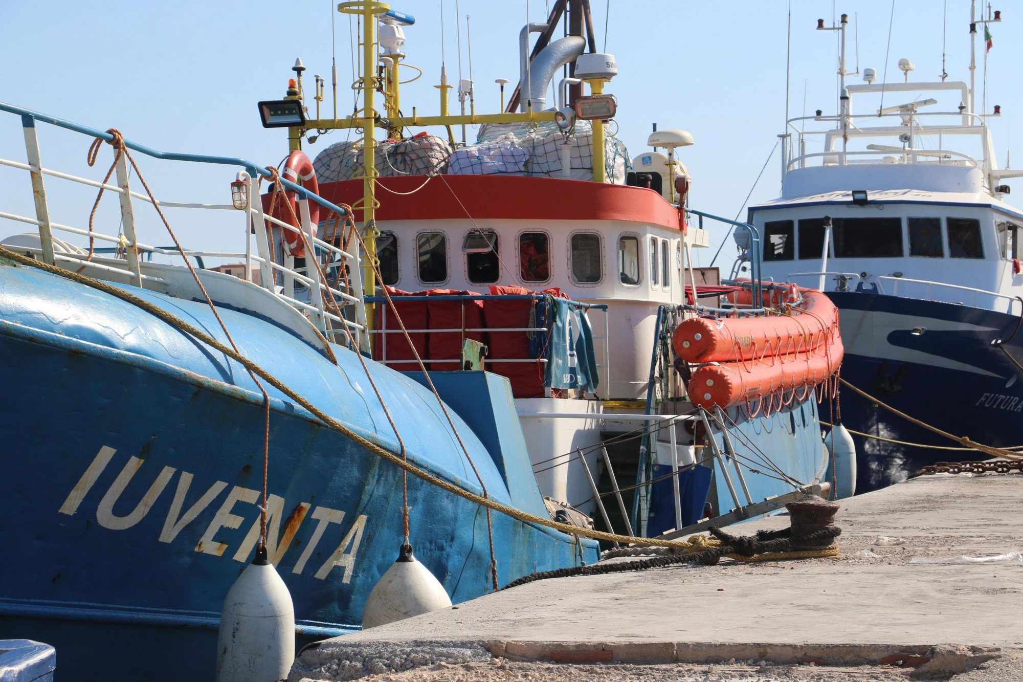 epa06120997 Iuventa Ship of the German NGO Jugend Rettet, one of the organizations that did not sign up to the Italian government Code of Conduct for migrant rescue ships, is docked for inspections in the Lampedusa harbor, Italy, 02 August 2017. Reports state some five aid groups, operating ships in the Mediterranean for rescuing migrants, rejected a new Code of Conduct, prepared by the Italian Interior Ministry, and their ships may now face additional checks from Italian authorities. The new Code of Conduct is said to face people smuggling, while opposing organizations say the new measures will affect effectiveness of their rescuing operations.  EPA/ELIO DESIDERIO ITALY MIGRATION SHIP INSPECTION