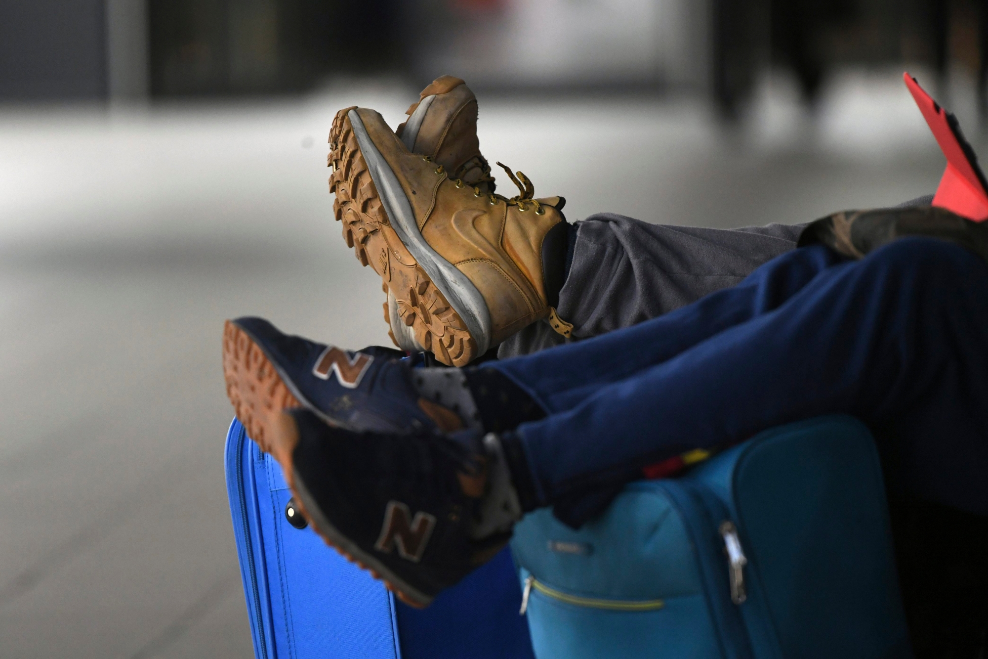 Travelers  wait at Schoenefeld airport outside Berlin, Germany,  Monday, March 13, 2017.  Ground staff at Berlin's two airports went on strike Monday for the second time in four days, forcing the cancellation of hundreds of flights. (Ralf Hirschberger/dpa via AP) Germany Airport Strike