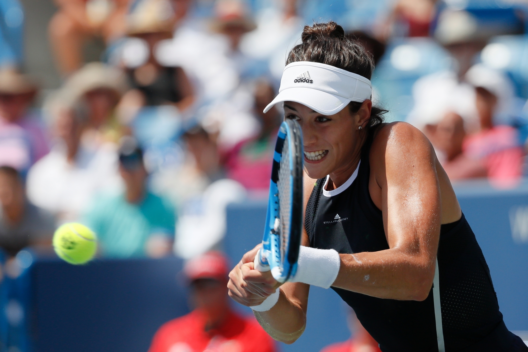 Garbine Muguruza, of Spain, returns to Simona Halep, of Romania, during the women's singles final at the Western & Southern Open, Sunday, Aug. 20, 2017, in Mason, Ohio. Muguruza won 6-1, 6-0. (AP Photo/John Minchillo)Gabrine Muguruza CINCINNATI TENNIS