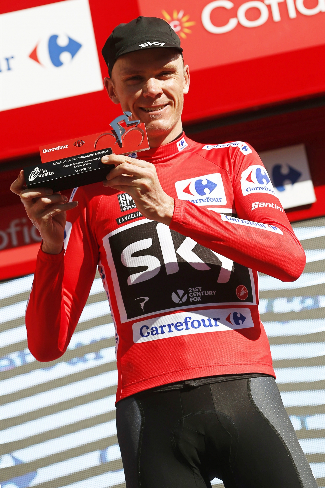 epa06154899 British rider Christopher Froome of Team Sky celebrates on the podium after taking the overall leader's red jersey following the third stage of the Vuelta a Espana cycling race over 158.5km from Prades Conflent Canigo, France, to Andorra la Vella, 21 August 2017.  EPA/JAVIER LIZONfroome RAD VUELTA 2017