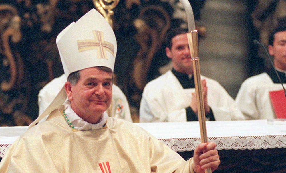 Vatican Secretary of State Cardinal Angelo Sodano applaudes Emil Paul Tscherrig of Switzerland after the latter was consecrated bishop in St. Peter's Thursday June 27, 1996. (AP Photo/Massimo Sambucetti)