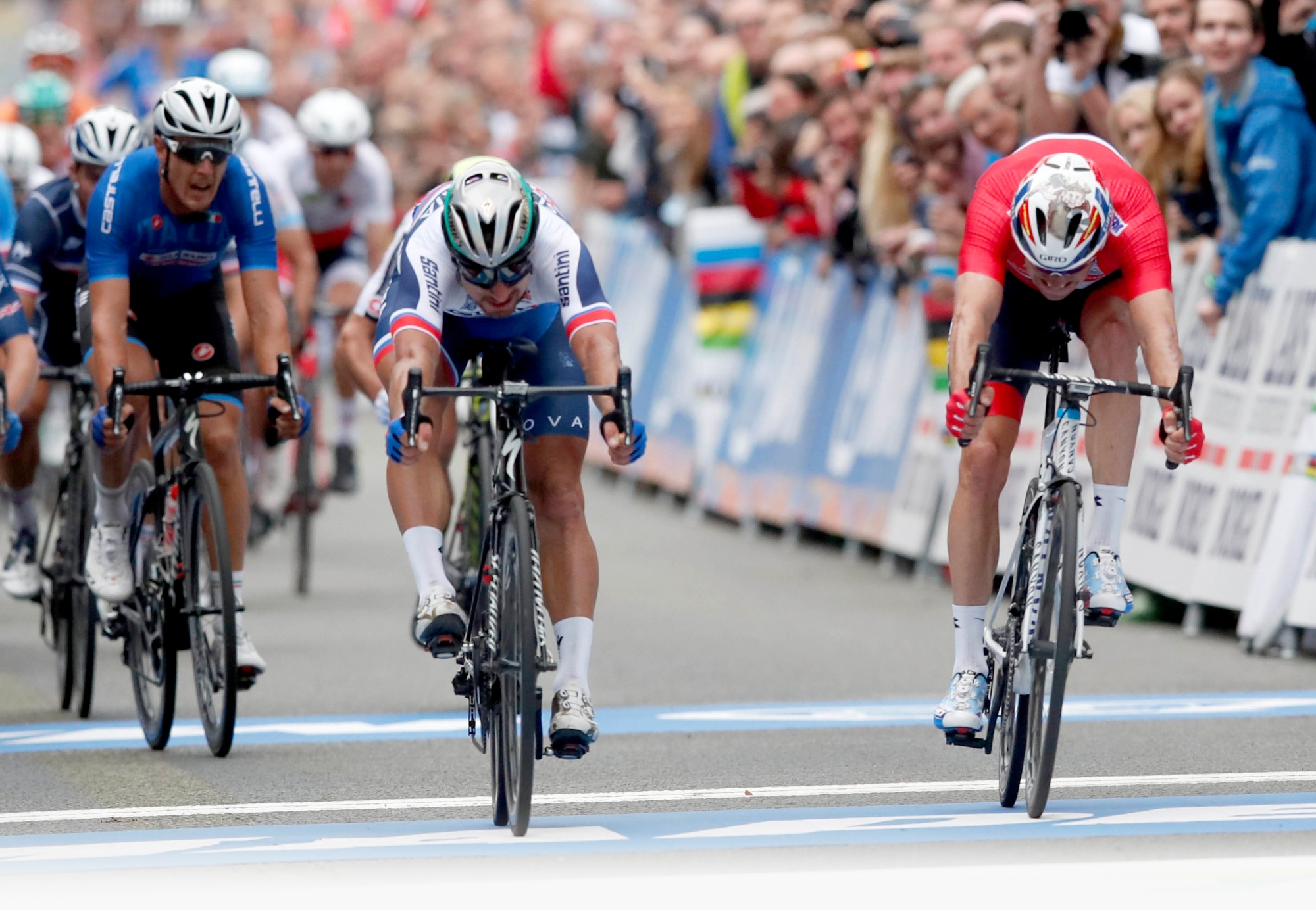 Peter Sagan of Slovakia, center, finishes in first place with Alexander Kristoff of Norway in second place in the Men's Elite Road Race at the UCI 2017 Road World Championship, in Bergen, Norway Sunday Sept. 24, 2017. (Cornelius Poppe/NTB Scanpix via AP) Norway UCI Road World Championships