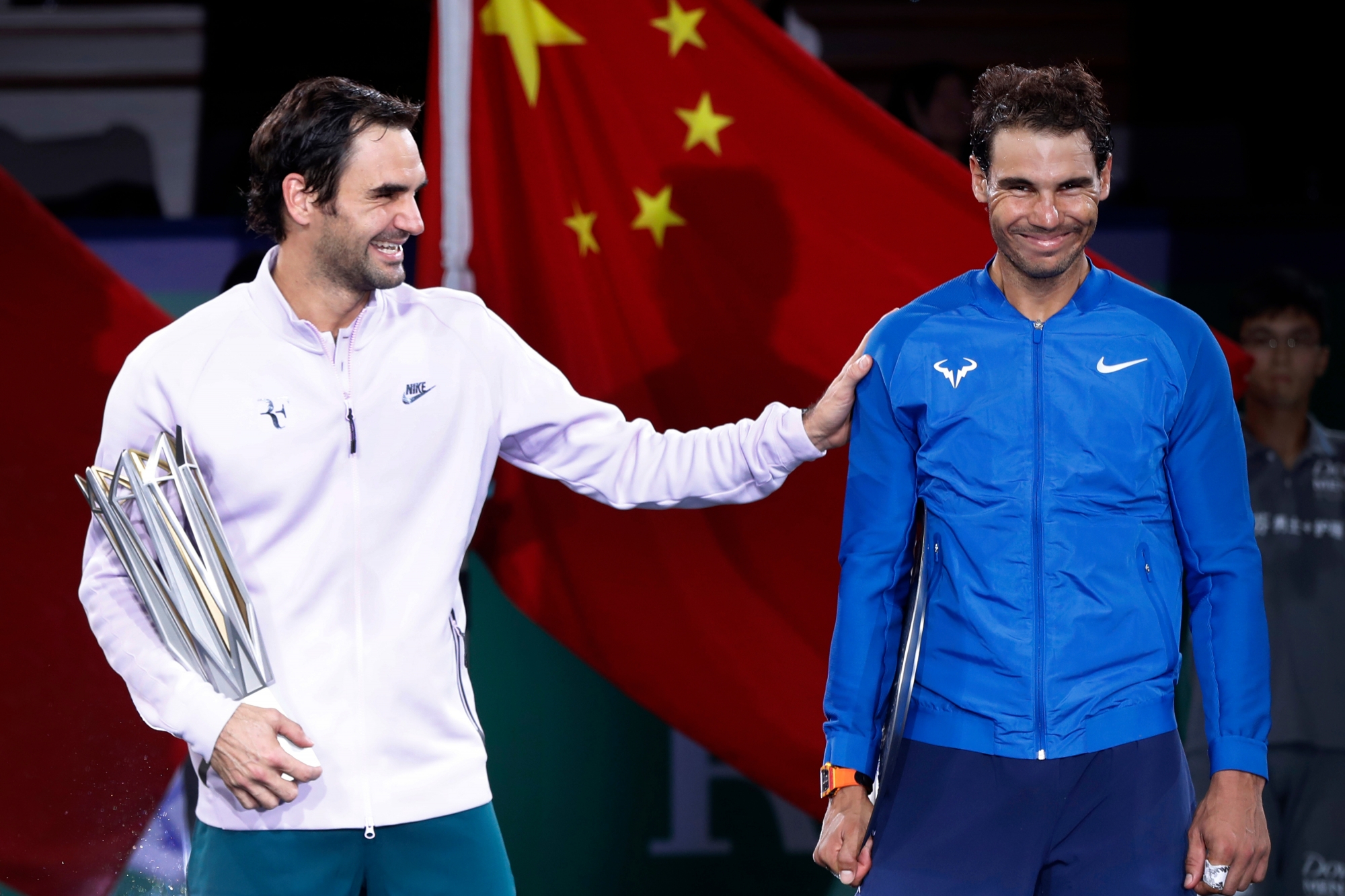 Roger Federer of Switzerland, left, gestures with Spain's Rafael Nadal after winning their men's singles final match in the Shanghai Masters tennis tournament at Qizhong Forest Sports City Tennis Center in Shanghai, China, Sunday, Oct. 15, 2017. (AP Photo/Andy Wong) APTOPIX China Tennis Shanghai Masters