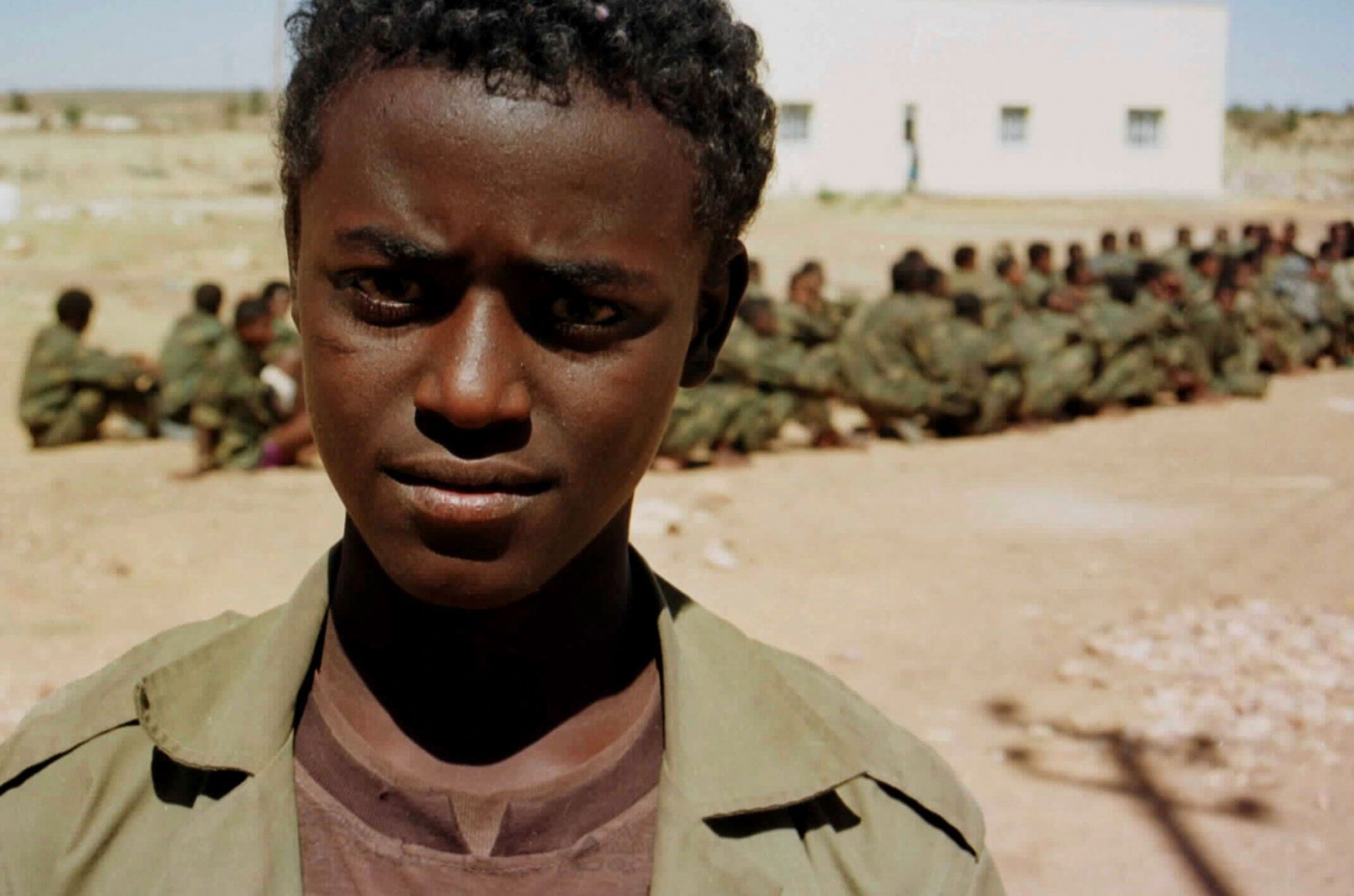 Dawit Admas, 17, one of 100 Ethiopian prisoners of war held by Eritrea near the Eritrean capital Asmara on Wednesday 10 February 1999.  Admas said that he was playing football in his home town Gondar when he was forcefully conscripted into the Ethiopian army and sent to fight on the disputed border with Eritrea.  The fighting has flared for the fifth day between Ethiopea and Eritrea over their unmarked border, a conflict that has simmered since Eritrea gained independence from Ethiopia six years ago.(AP PHOTO/Sami Sallinen) ERITREA