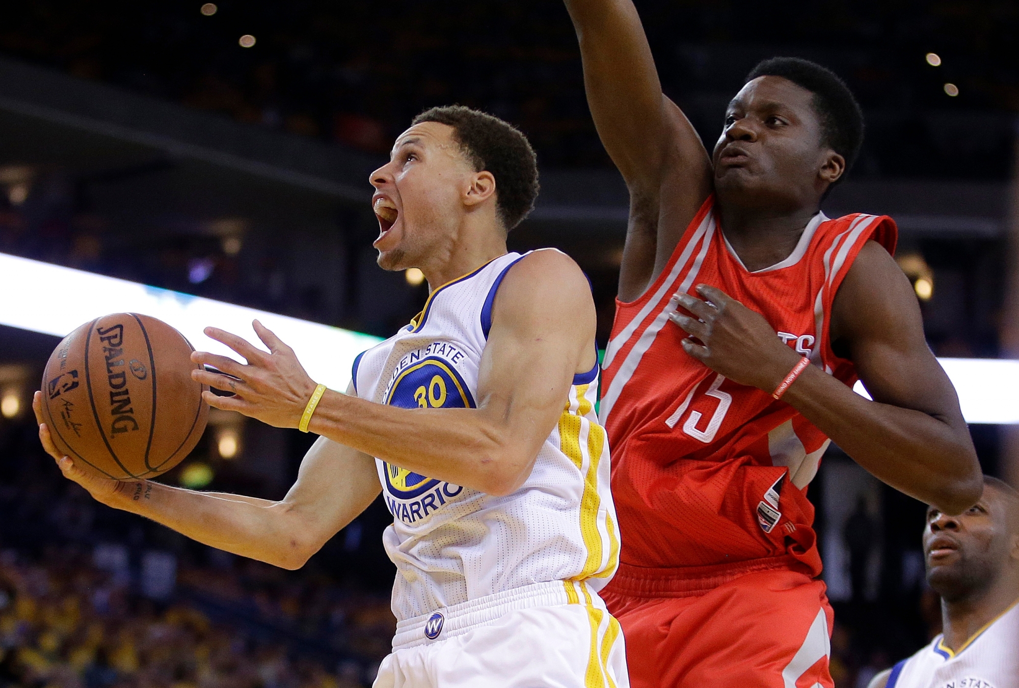 Golden State Warriors guard Stephen Curry (30) shoots against Houston Rockets center Clint Capela (15) during the second half of Game 2 of the NBA basketball Western Conference finals in Oakland, Calif., Thursday, May 21, 2015. (AP Photo/Rick Bowmer)d ROCKETS WARRIORS BASKETBALL