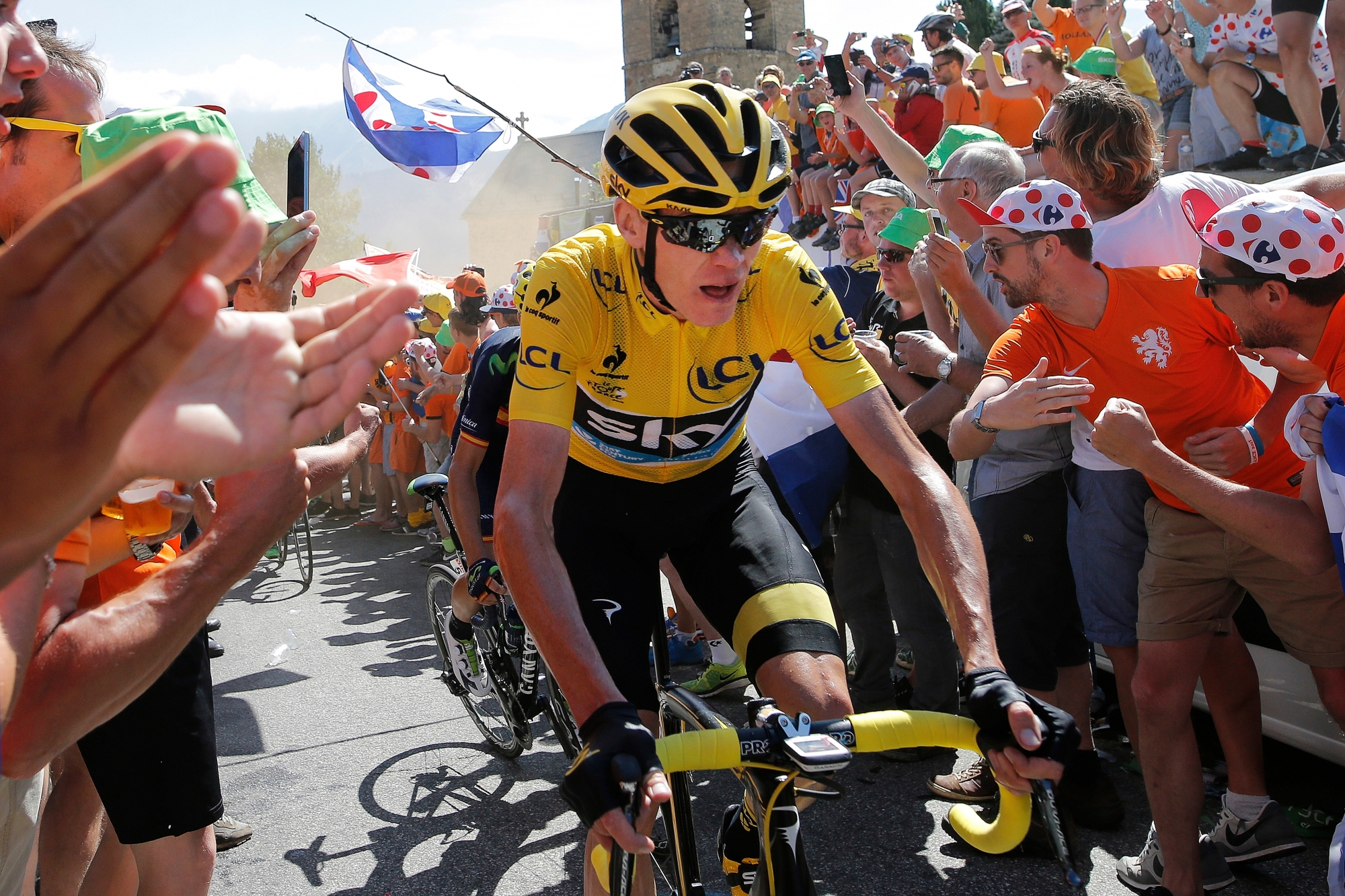 Britain's Chris Froome, wearing the overall leader's yellow jersey, climbs towards Alpe d'Huez during the twentieth stage of the Tour de France cycling race over 110.5 kilometers (68.7 miles) with start in Modane and finish in Alpe d'Huez, France, Saturday, July 25, 2015. (AP Photo/Laurent Cipriani)d RAD TOUR DE FRANCE 2015