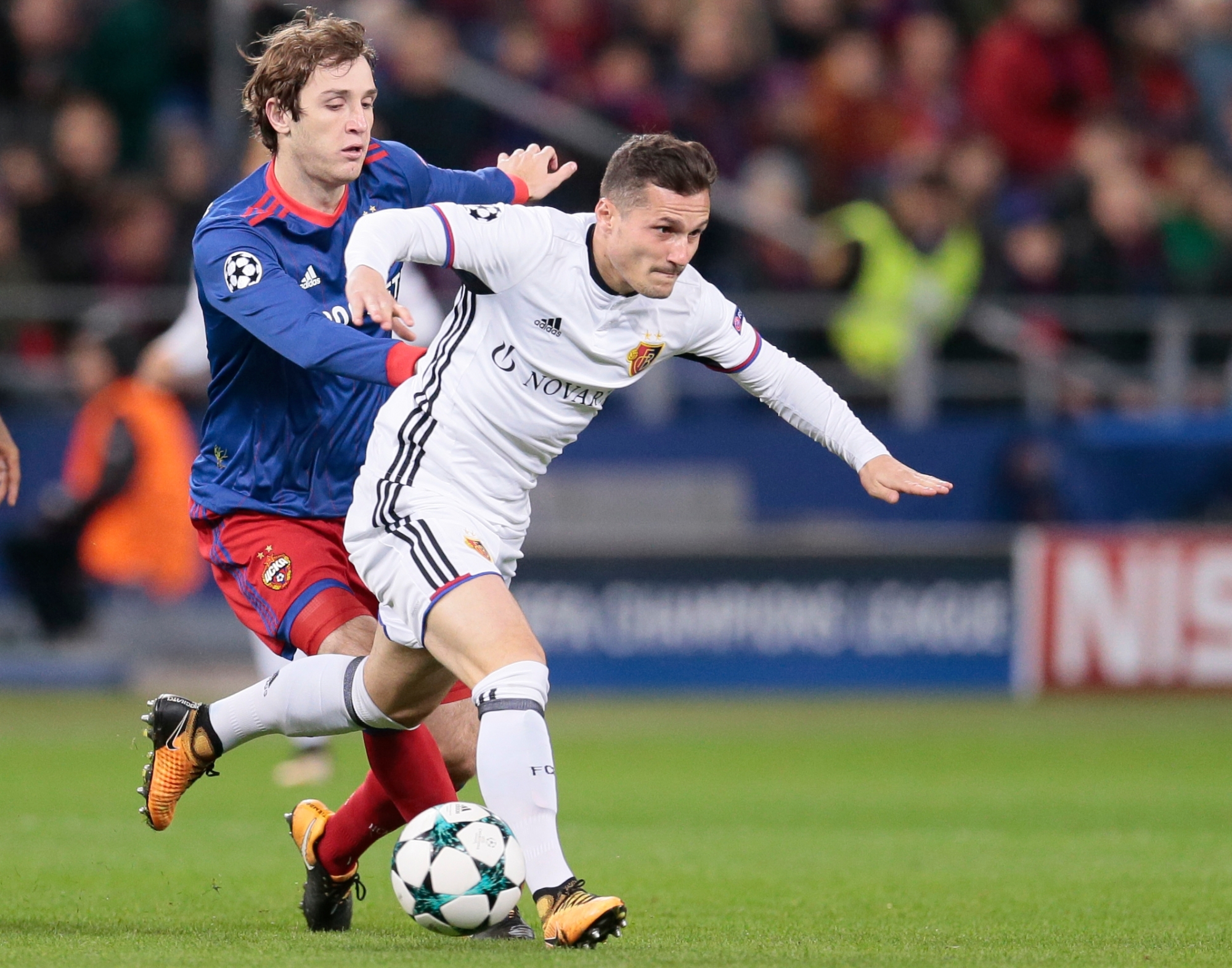 CSKA's Mario Fernandes, left, challenges for the ball with Basel's Taulant Xhaka during the Champions League Group A soccer match between CSKA Moscow and Basel in Moscow, Russia, Wednesday, Oct. 18, 2017. (AP Photo/Ivan Sekretarev) Russia Soccer Champions League