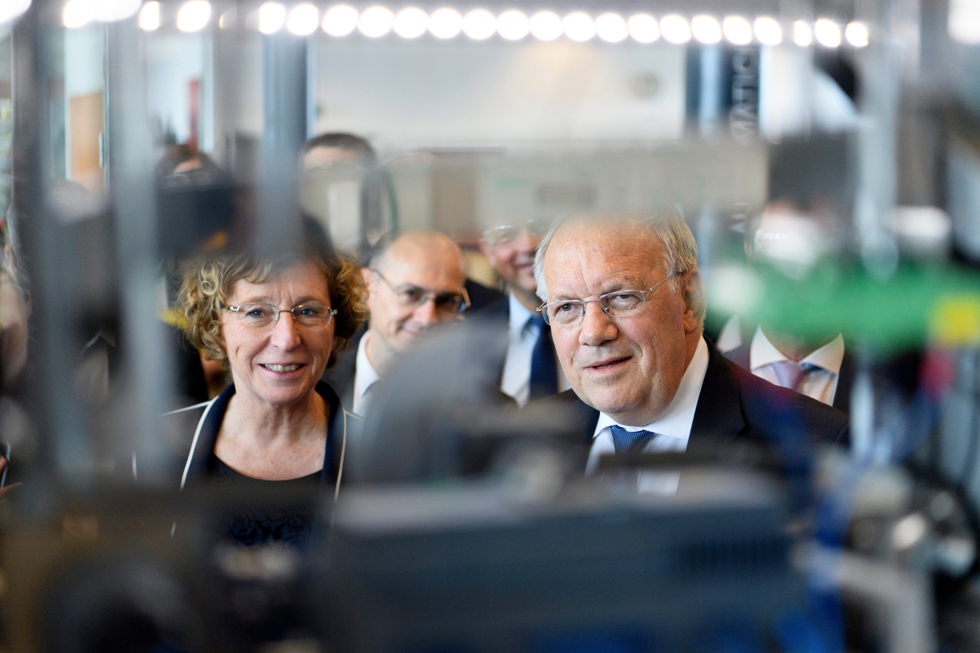 Swiss Federal Councillor Johann Schneider-Ammann, left, speaks with French Labour Minister Muriel Penicaud, center, as they visit the Bobst Learning Center, the world's leading suppliers of equipment and services to packaging and label manufacturers in the folding carton, corrugated board and flexible materials industries, in Mex, Switzerland, Thursday, October 26, 2017. (KEYSTONE/Laurent Gillieron) SWITZERLAND FRANCE BOBST LEARNING