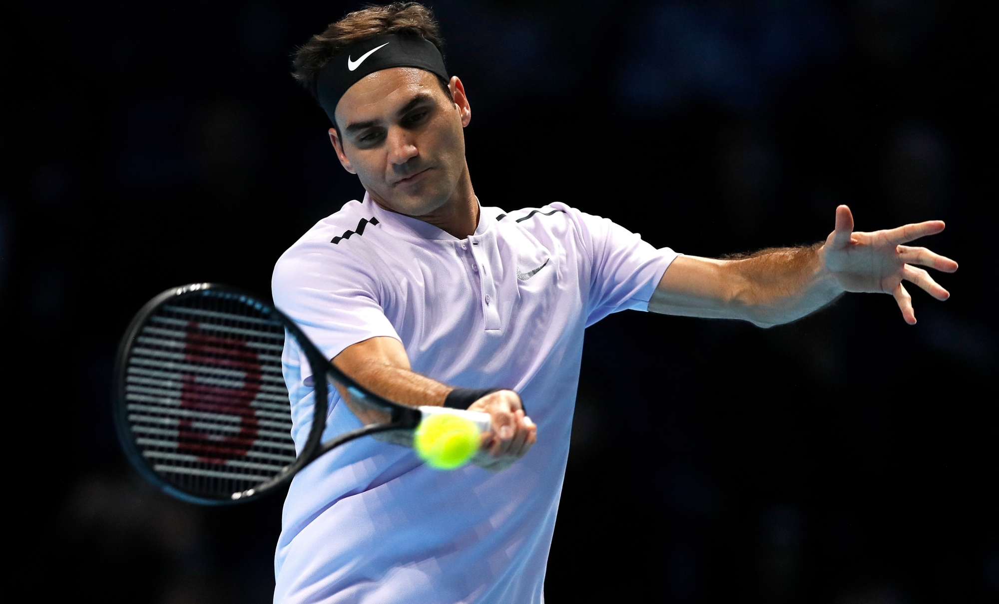 Roger Federer of Switzerland plays a return to Jack Sock of the United States during their singles tennis match at the ATP World Finals at the O2 Arena in London, Sunday, Nov. 12, 2017. (AP Photo/Kirsty Wigglesworth) Britain Tennis ATP Finals