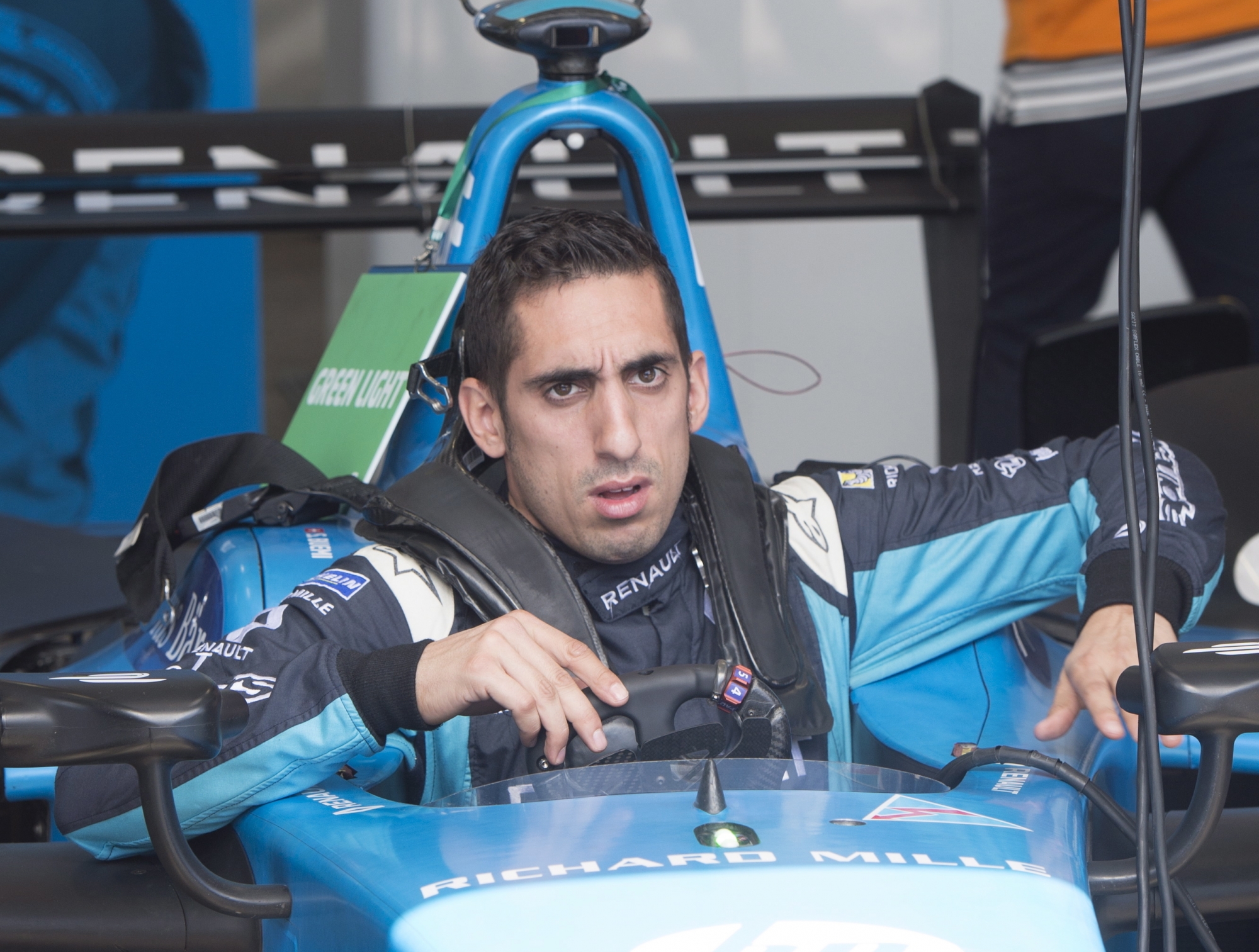 Points leader Sebastien Buemi, of Switzerland, checks out his Renault team car at the Montreal Formula ePrix electric car race in Montreal on Friday, July 28, 2017. (Ryan Remiorz/The Canadian Press via AP)