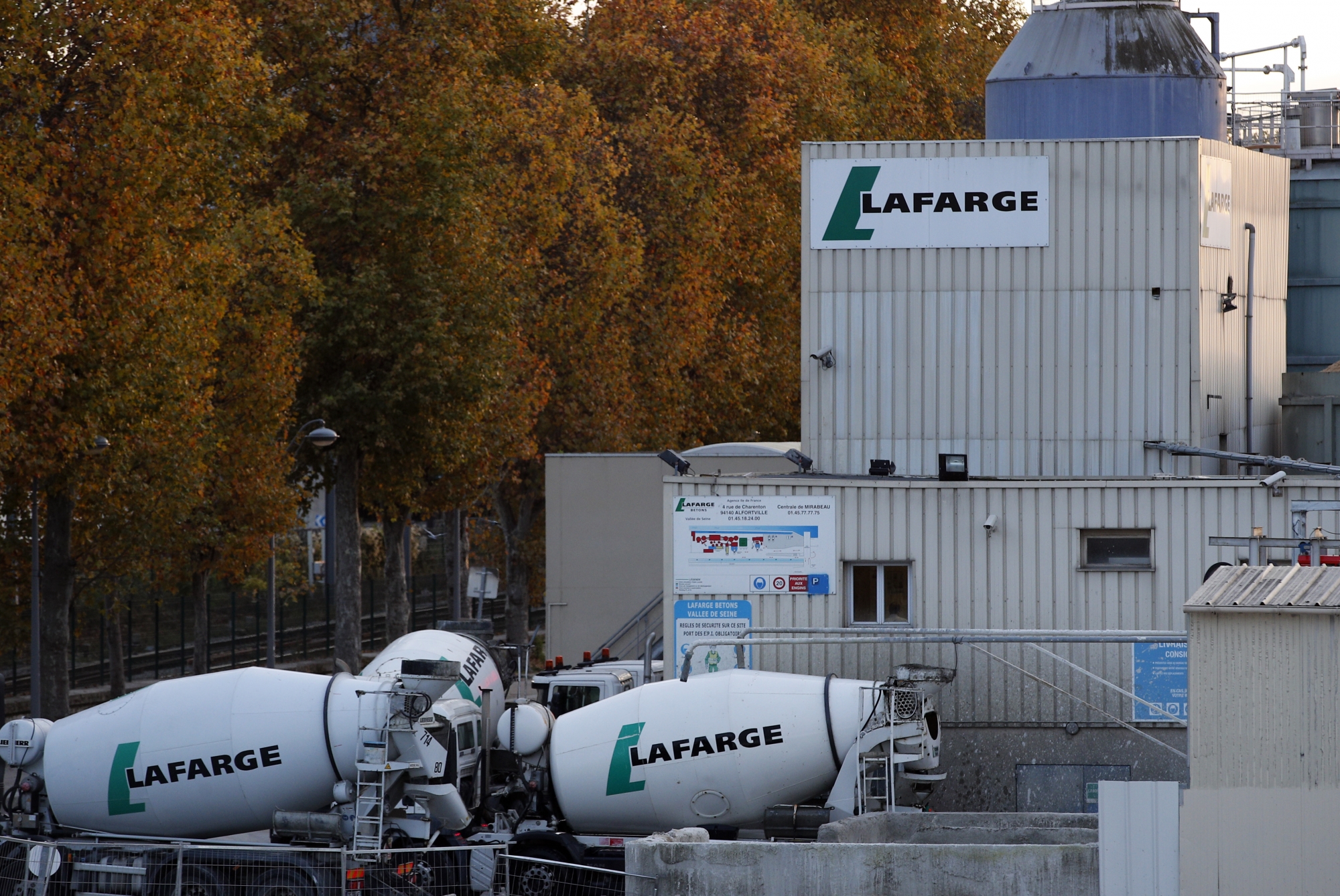 A site of cement maker Lafarge is pictured in Paris, Tuesday, Nov. 14, 2017. French investigators are searching the French offices of LafargeHolcim, the world's largest cement maker, as part of an investigation into the group's deals with armed groups in Syria. (AP Photo/Christophe Ena) France Lafarge Syria