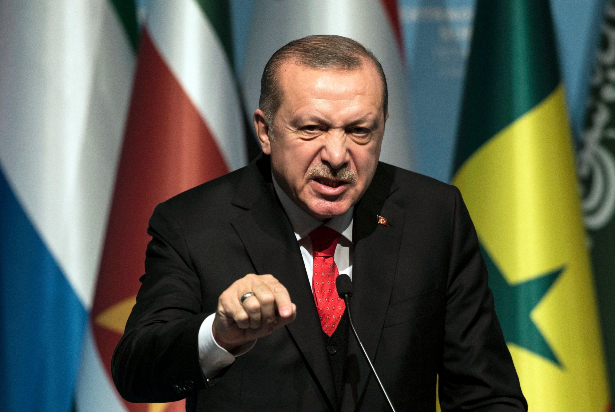 epa06387396 Turkish President Recep Tayyip Erdogan speaks at a press conference after the extraordinary summit of the Organisation of Islamic Cooperation (OIC) in Istanbul, Turkey, 13 December 2017. Leaders of OIC gather in Istanbul after US president Donald J. Trump on 06 December announced he is recognising Jerusalem as the Israel capital and will relocate the US embassy from Tel Aviv to Jerusalem.  EPA/SEDAT SUNA TURKEY ORGANISATION OF ISLAMIC COOPERATION