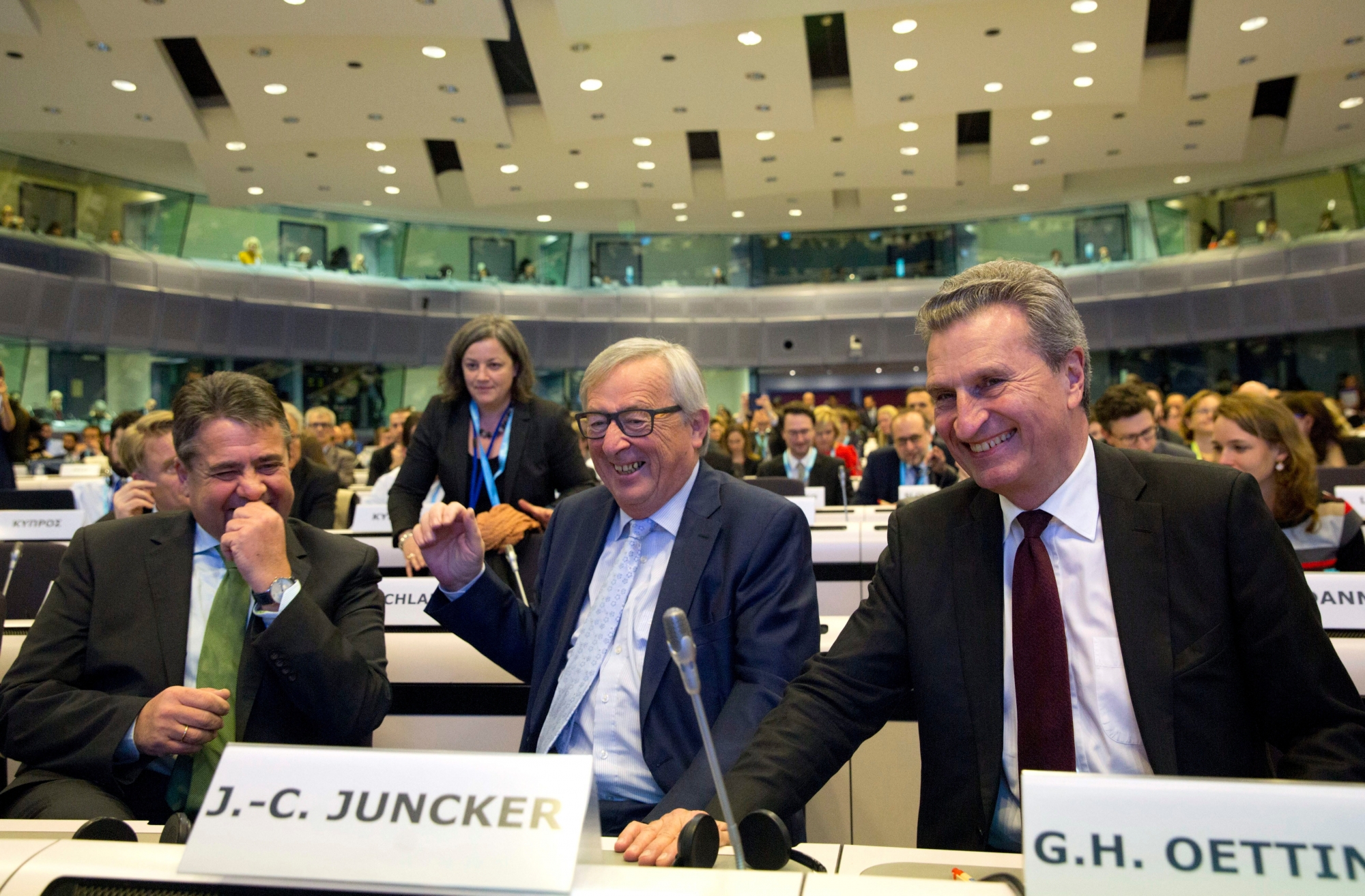 European Commission President Jean-Claude Juncker, center, European Commissioner for Digital Economy Guenther Oettinger, right, and German Foreign Minister Sigmar Gabriel, left, attend a conference 'Shaping Our Future' at the EU Charlemagne building in Brussels on Monday, Jan. 8, 2018. European Commission President Jean-Claude Juncker opened a debate Monday on the EU's next long-term budget, laying out the bloc's spending priorities over the seven years from 2021-2026. (AP Photo/Virginia Mayo) Belgium EU Budget