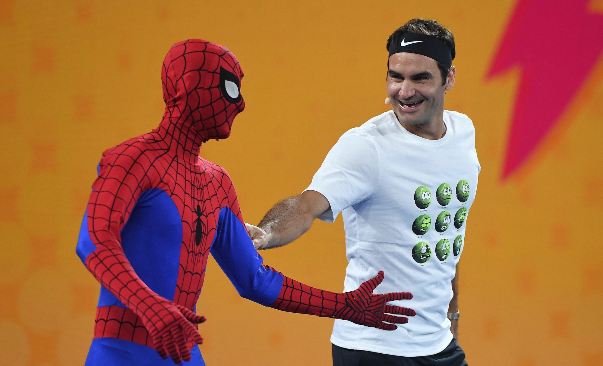 epa06434586 Roger Federer of Switzerland (R) is seen alongside a person dressed as Spiderman as he participates in the Rod Laver Arena Spectacular during the Kids Tennis Day at Melbourne Park in Melbourne, Victoria, Australia, 13 January 2018.  EPA/JULIAN SMITH  AUSTRALIA AND NEW ZEALAND OUT AUSTRALIA TENNIS AUSTRALIAN OPEN GRAND SLAM