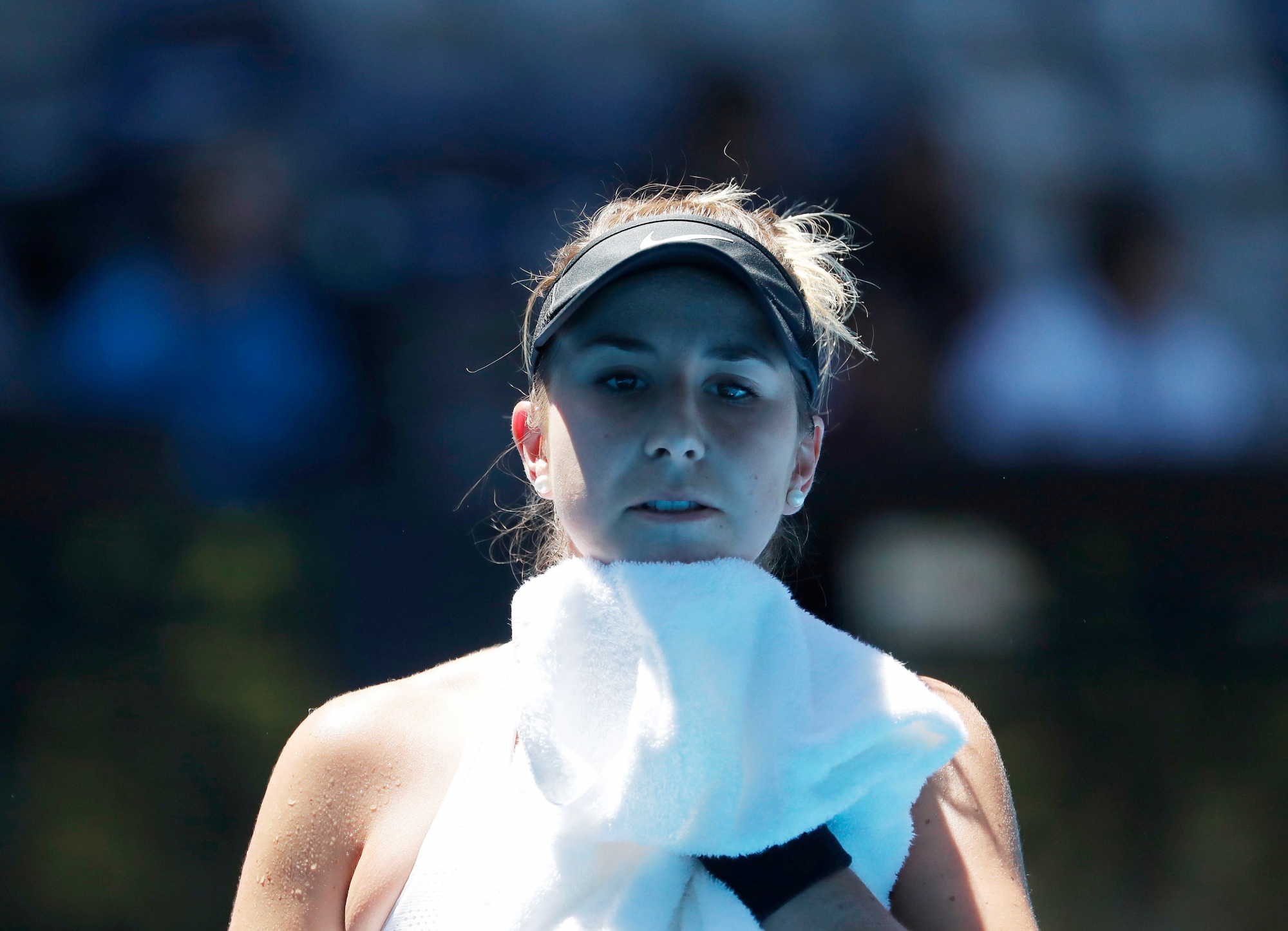 epa06445143 Belinda Bencic of Switzerland holds a towel during a break in her second round match against Luksika 'Luk' Kumkhum of Thailand at the Australian Open Grand Slam tennis tournament in Melbourne, Australia, 17 January 2018.  EPA/MAST IRHAM AUSTRALIA TENNIS AUSTRALIAN OPEN GRAND SLAM