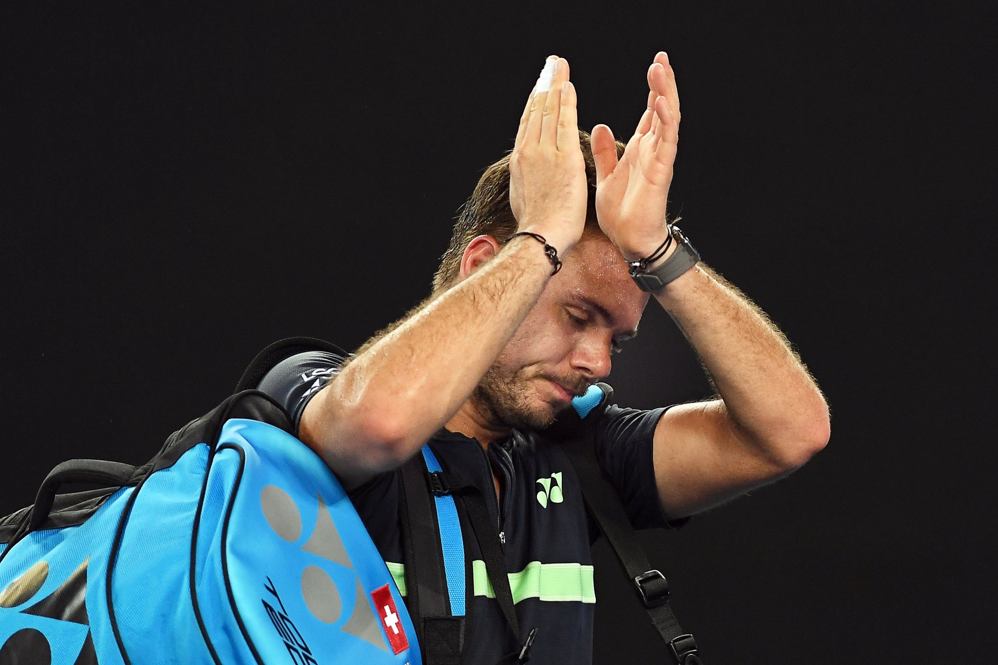 epa06449599 Stan Wawrinka of Switzerland reacts after losing his second round match against Tennys Sandgren of the USA at the Australian Open Grand Slam tennis tournament in Melbourne, Australia, 18 January 2018.  EPA/JULIAN SMITH AUSTRALIA AND NEW ZEALAND OUT AUSTRALIA TENNIS AUSTRALIAN OPEN GRAND SLAM