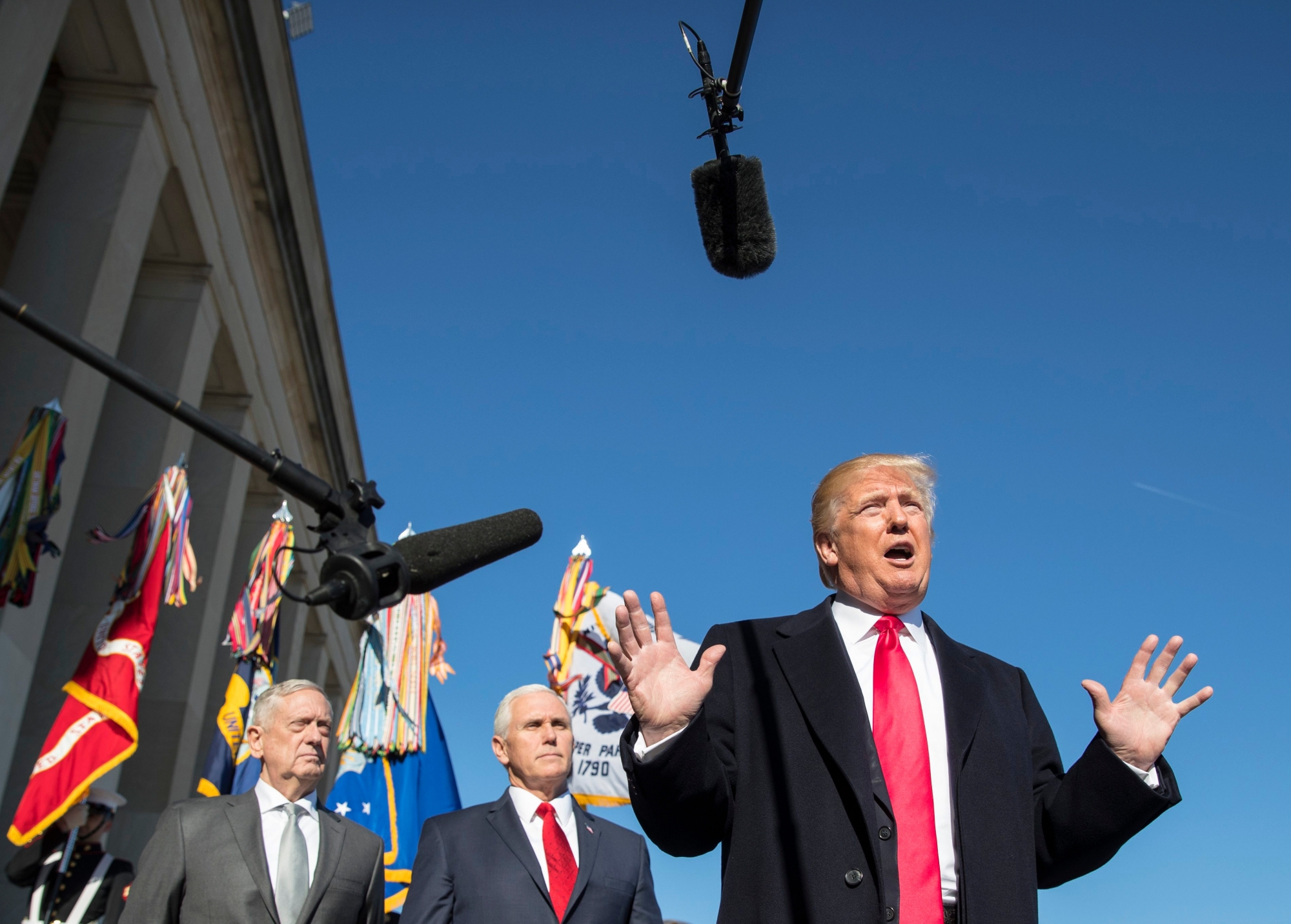 President Donald Trump, joined by Defense Secretary Jim Mattis, left, and Vice President Mike Pence, speaks to the media as he arrives at the Pentagon, Thursday, Jan. 18, 2018. (AP Photo/Carolyn Kaster) Trump