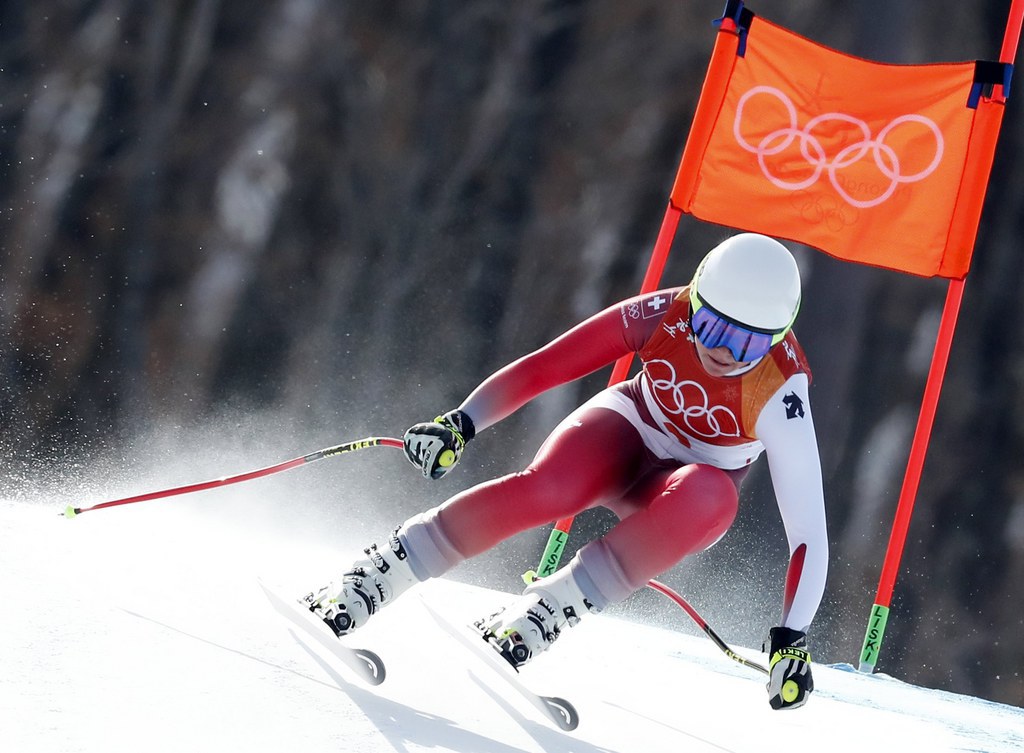 epa06548120 Corinne Suter of Switzerland speeds down the slope during the Women's Downhill race at the Jeongseon Alpine Centre during the PyeongChang 2018 Olympic Games, South Korea, 21 February 2018.  EPA/GUILLAUME HORCAJUELO