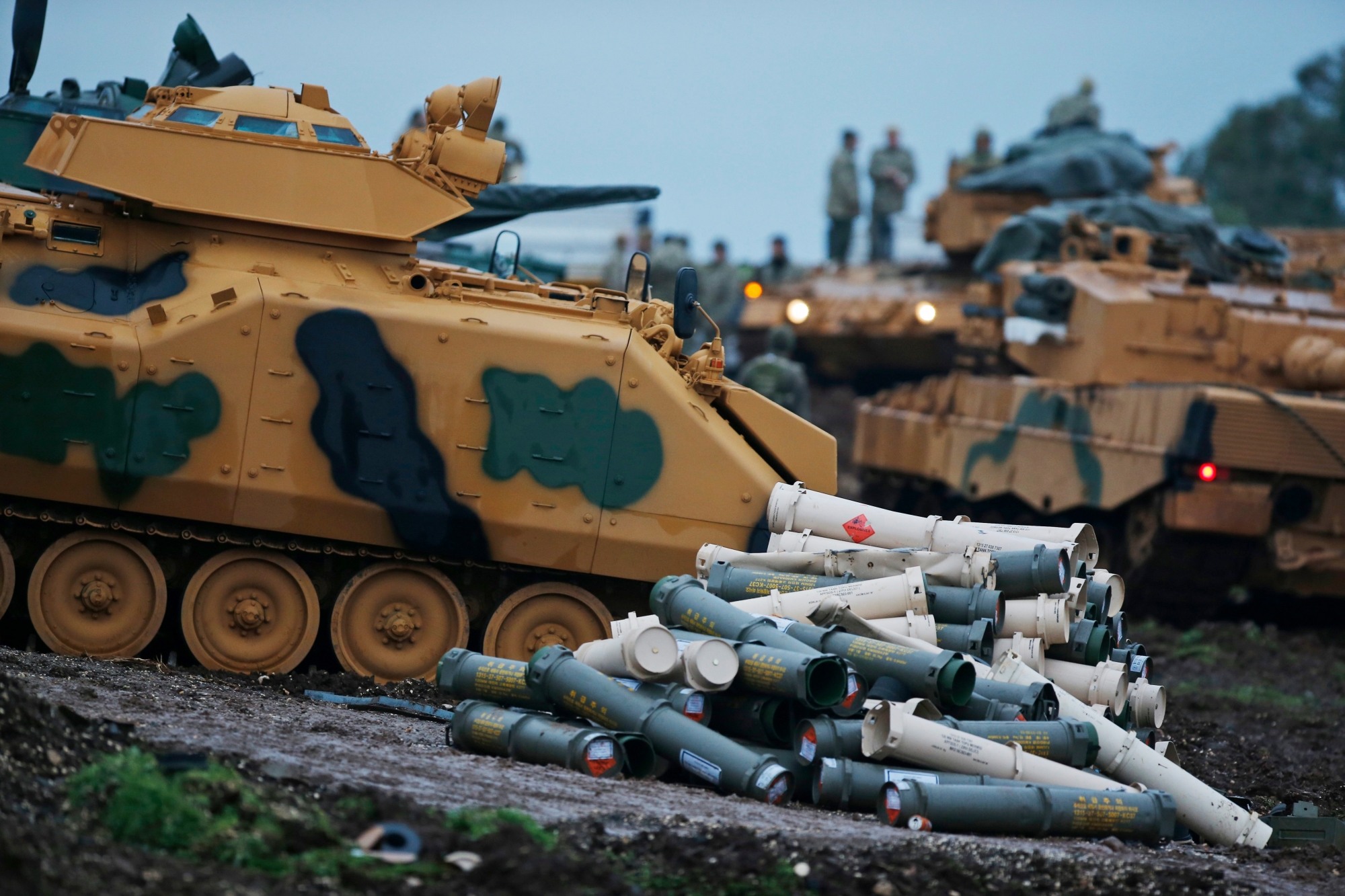 Turkish soldiers prepare their tanks to enter combat and join a military offensive on a Kurdish-held enclave in northern Syria, at a staging area in the Hatay province,Turkey near the the border with Syria.Turkey launched an operation, codenamed Olive Branch, last week against the Syrian Kurdish People's Protection Units in Afrin, Syria that it deems a terror group. The operation codenamed Olive Branch is on its fourth day. (AP Photo/Lefteris Pitarakis) Turkey Syria