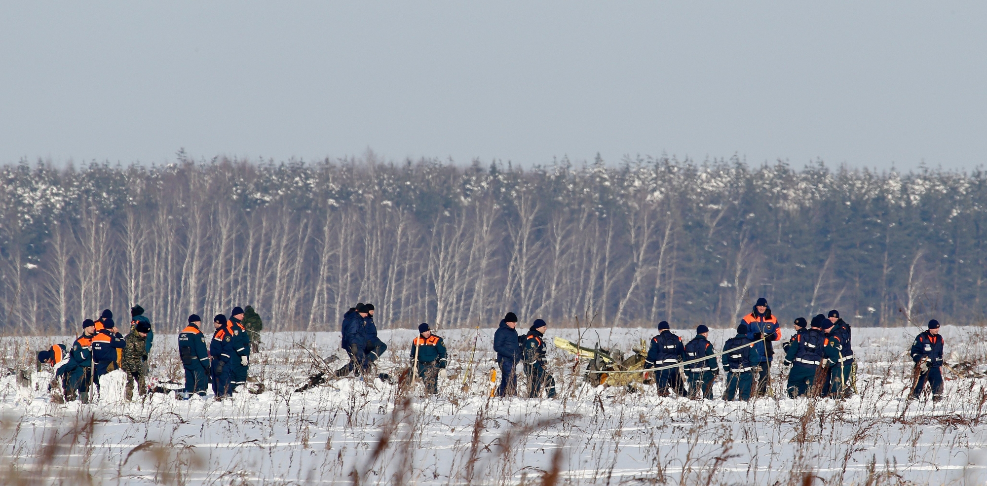Personnel work at the scene of a AN-148 plane crash in Stepanovskoye village, about 40 kilometers (25 miles) from the Domodedovo airport, Russia, Moday, Feb. 12, 2018. A Russian passenger plane carrying 71 people crashed Sunday near Moscow, killing everyone aboard shortly after the jet took off from one of the city's airports. The Saratov Airlines regional jet disappeared from radar screens a few minutes after departing from Domodedovo Airport en route to Orsk, a city some 1,500 kilometers (1,000 miles) southeast of Moscow. (AP Photo/Alexander Zemlianichenko) Russia Plane Crash