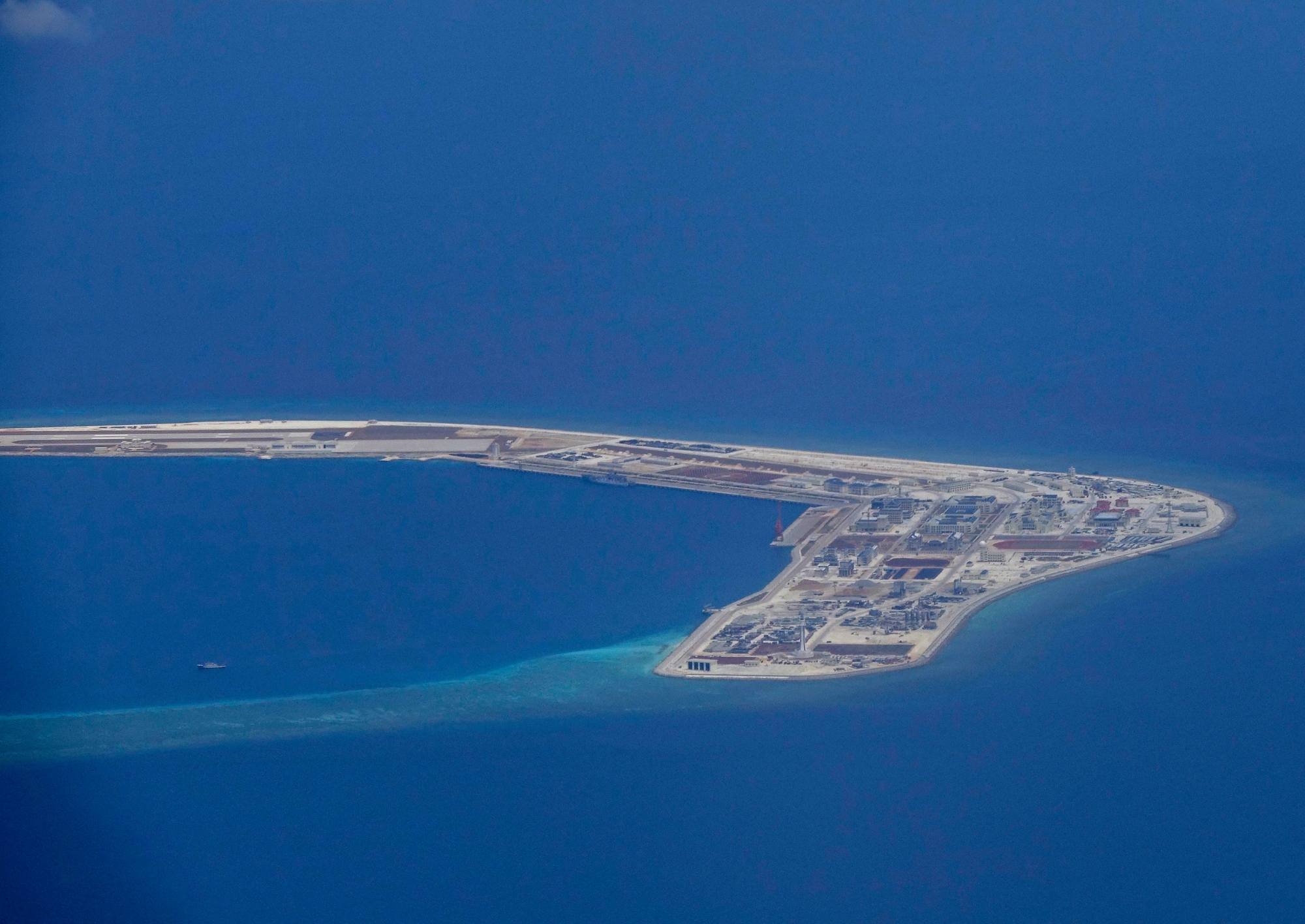 epa05918658 An aerial view of the Subi reef, one of the tiny islands being claimed by China in the disputed South China Sea, photographed through an aircraft's window on 21 April 2017. According to news reports, President Rodrigo Duterte has ordered the Armed Forces of the Philippines (AFP) to occupy all islands of the Philippines in the South China Sea to strengthen the country's claims. Aside from Philippines and China, other countries have overlapping claims in parts of the South China Sea including Brunei, Malaysia, Vietnam and Taiwan.  EPA/FRANCIS R. MALASIG AT SEA PHILIPPINES SOUTH CHINA SEA DISPUTE