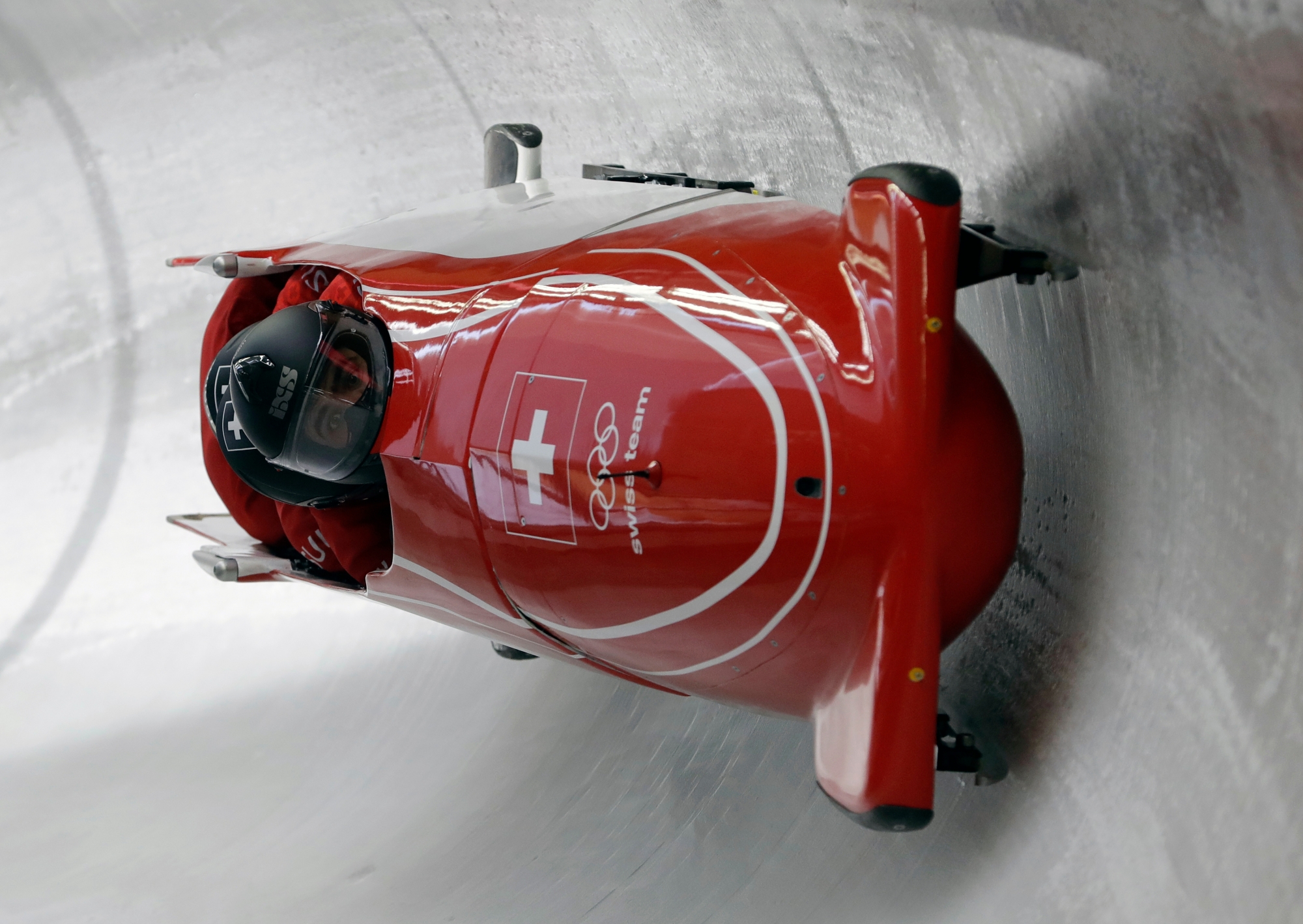 Driver Clemens Bracher, Fabio Badraun, Sandro Ferrari and Martin Meier of Switzerland take a practice run during training for the four-man bobsled competition at the 2018 Winter Olympics in Pyeongchang, South Korea, Thursday, Feb. 22, 2018. (AP Photo/Michael Sohn) Pyeongchang Olympics Bobsled