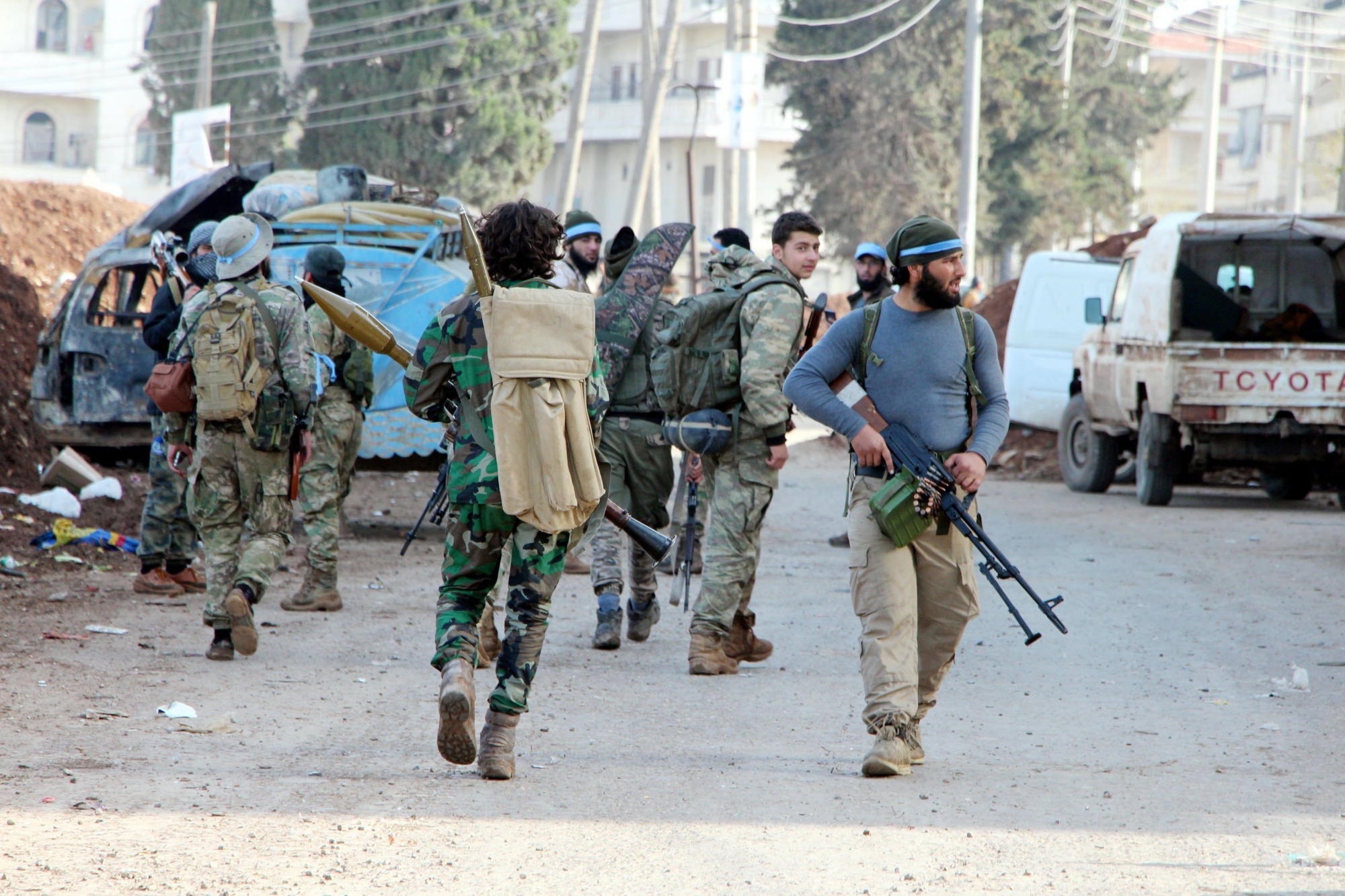 epa06611805 Turkey-backed Free Syrian Army soldiers take control of Afrin city center, Syria, 18 March 2018. According to media reports, the Turkish army and its allied Syrian militias on 10 March continued to encircle the city of Afrin in the Kurdish-held enclave of the same name in northwest Syrian, taking control of nine towns. The Turkish army on 20 January launched 'Operation Olive Branch' in Syria's northern regions against the Kurdish Popular Protection Units (YPG) forces and the Syrian Democratic Forces (SDF) which control the city of Afrin. Turkey classifies the YPG as a terrorist organization. The Turkish-backed Free Syrian Army is an armed rebel military group that operates in northern Syria and is supported by the Turkish army.  EPA/DHA / DOGAN NEWS AGENCY SYRIA AFRIN TURKEY YPG