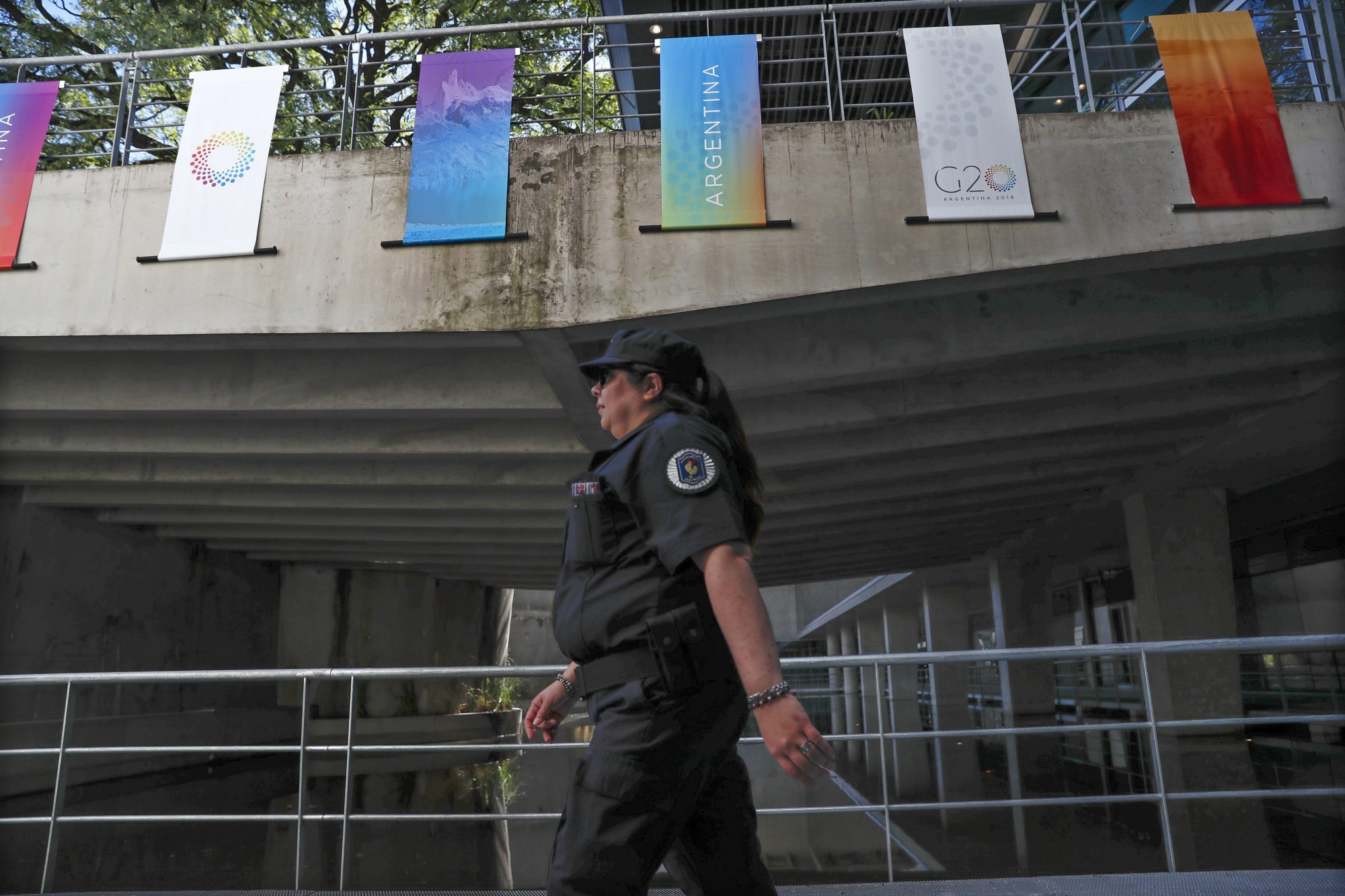 epa06614356 A member of the Argentine Gendarmerie performs surveillance work in the surroundings of the Exhibition and Convention Center where the G20 meetings take place, in Buenos Aires, Argentina, 19 March 2018. The meeting of finance ministers and presidents of central banks of the G20 began in Buenos Aires on 19 March 2018 with a private meeting in which economic leaders are expected to address the future of work and the global tax system, with the ghosts of protectionism freshly revived.  EPA/DAVID FERNANDEZ ARGENTINA G20 FINANCE