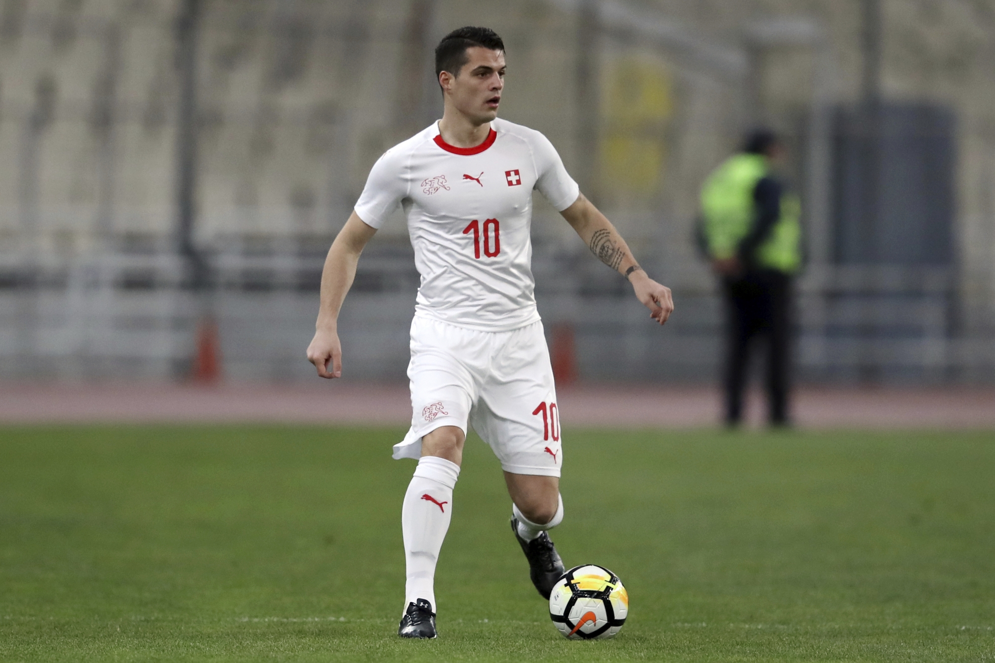 Switzerland's Granit Xhaka controls the ball during an international friendly soccer match against Greece at the Olympic stadium in Athens, Friday, March 23, 2018. (AP Photo/Thanassis Stavrakis)
