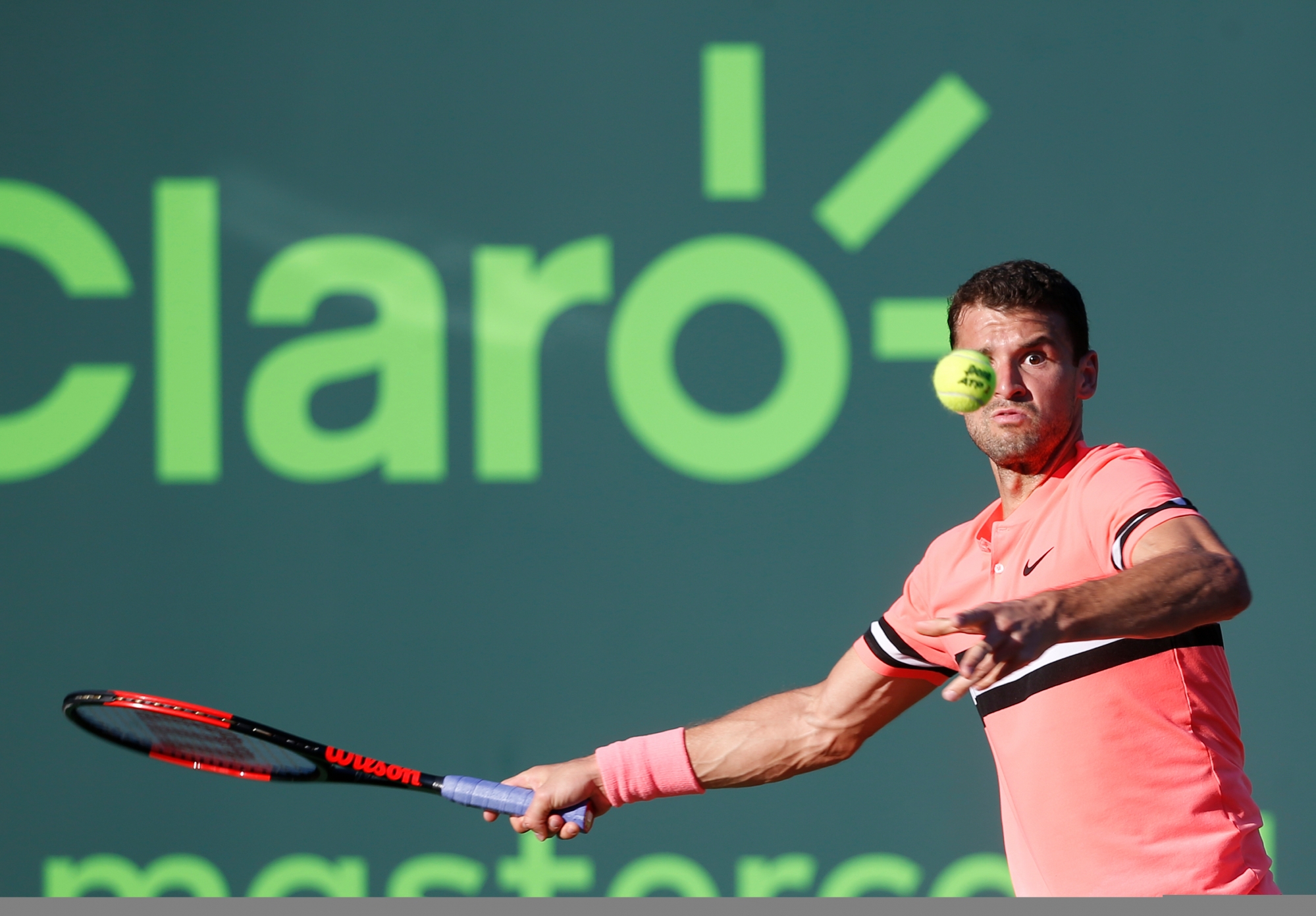 Grigor Dimitrov, of Bulgaria, returns a shot from Jeremy Chardy, of France, during a tennis match at the Miami Open, Sunday, March 25, 2018, in Key Biscayne, Fla. Chardy defeated Dimitrov 6-4, 6-4. (AP Photo/Wilfredo Lee) Miami Open Tennis
