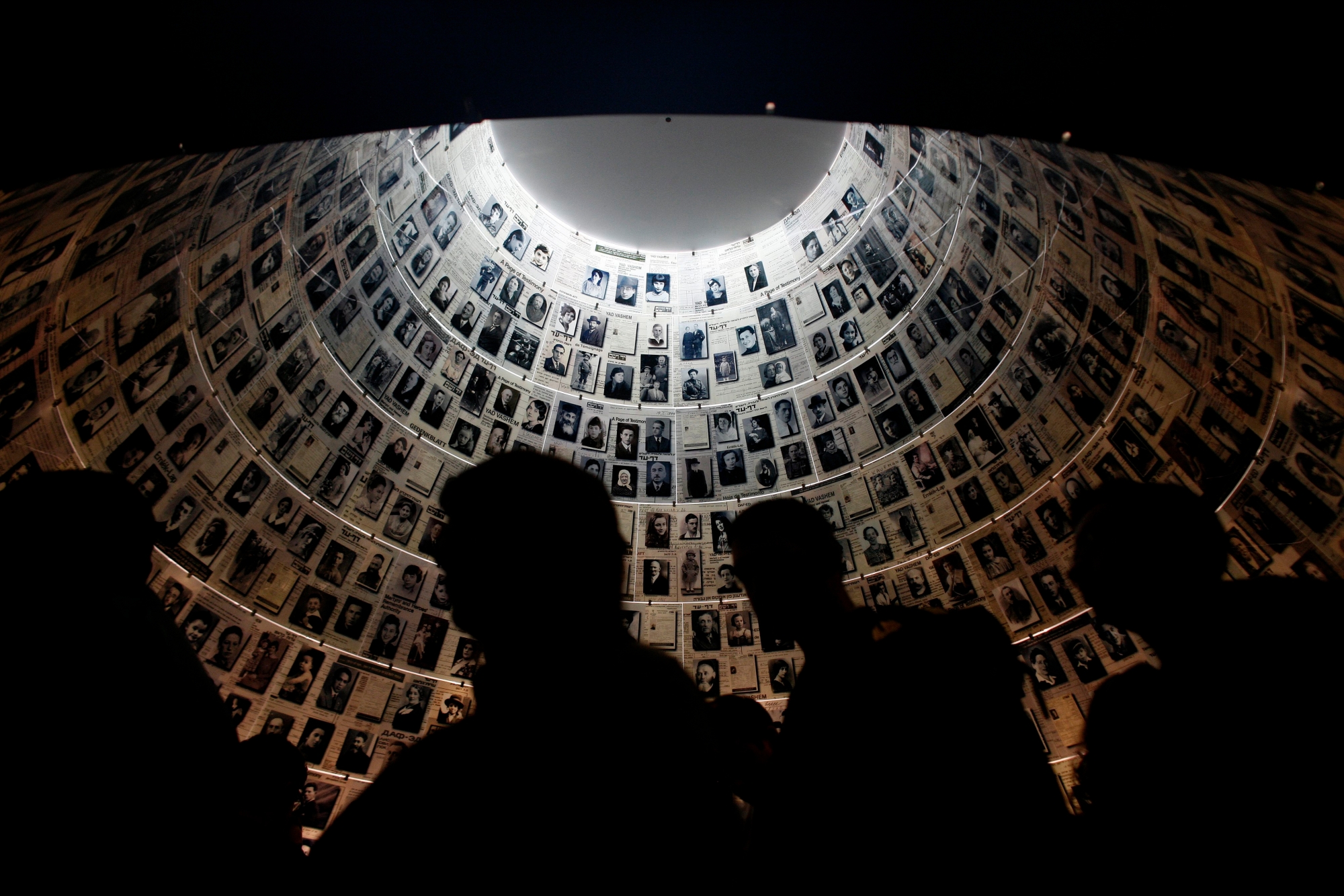 epa02551742 Visitors view the Hall of Names in the Yad Vashem Holocaust memorial in Jerusalem, on the International Holocaust Remembrance Day, on 27 January 2011. The International Holocaust Remembrance Day, commemorates the Jewish people that perished under the Nazi regime. Germany's parliament on Thursday mourned the victims of the Holocaust, with its speaker Norbert Lammert saying the horrors perpetrated by Nazi Germany must never be forgotten.  EPA/OLIVER WEIKEN MIDEAST ISRAEL HOLOCAUST REMEMBRANCE DAY