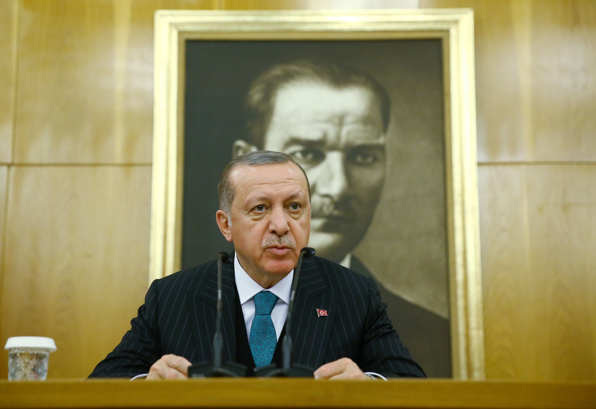 epa06632498 A handout photo made available by the Turkish Presidential Press Office on 27 March shows Turkish President Recep Tayyip Erdogan speaking to the media in front of the Ataturk's picture at Ataturk airport in Istanbul, Turkey, 26 February 2018, before travelling to Algeria. According to news report Turkish President Recep Tayyip Erdogan passed Mustafa Kemal Ataturk (founder of modern Turkey) as longest ruling Turk.  EPA/TURKISH PRESIDENTAL PRESS OFFICE / HANDOUT  HANDOUT EDITORIAL USE ONLY/NO SALES TURKEY PRESIDENT ERDOGAN