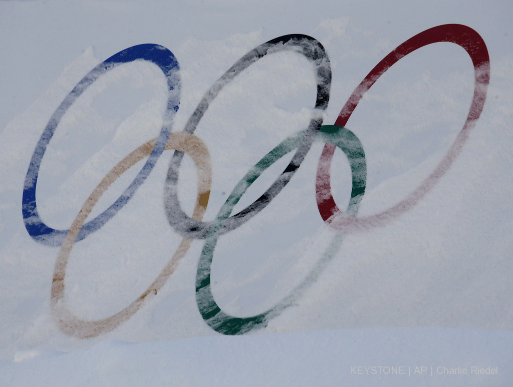Olympic rings are covered with fresh snow at the Phoenix Snow Park as preparations continue for the 2018 Winter Olympics in Pyeongchang, South Korea, Saturday, Feb. 3, 2018. The venue will host freestyle skiing and snowboarding events. (AP Photo/Charlie Riedel)