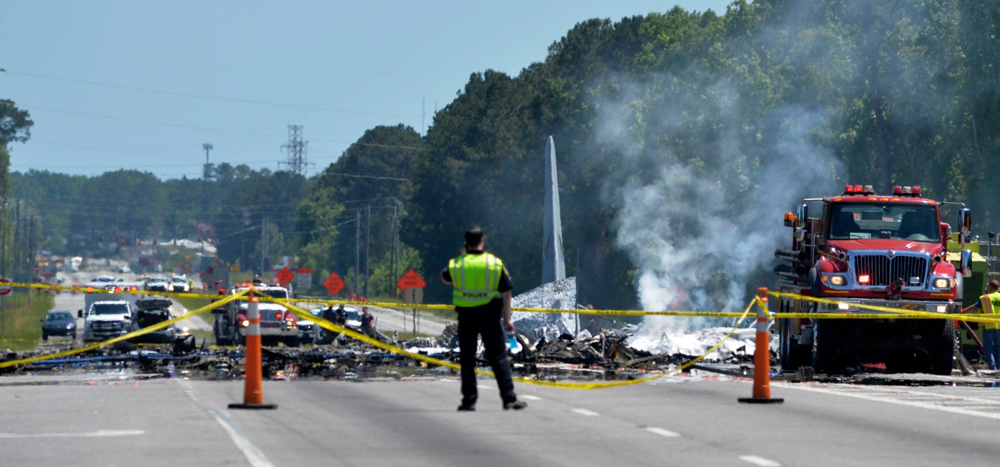 First responders work the scene of a deadly crash of an Air National Guard C-130 cargo plane from Puerto Rico near the intersection of state highway Georgia 21 and Crossgate Road in Port Wentworth, Ga., Wednesday, May 2, 2018. (Steve Bisson/Savannah Morning News via AP) Military Plane Crash