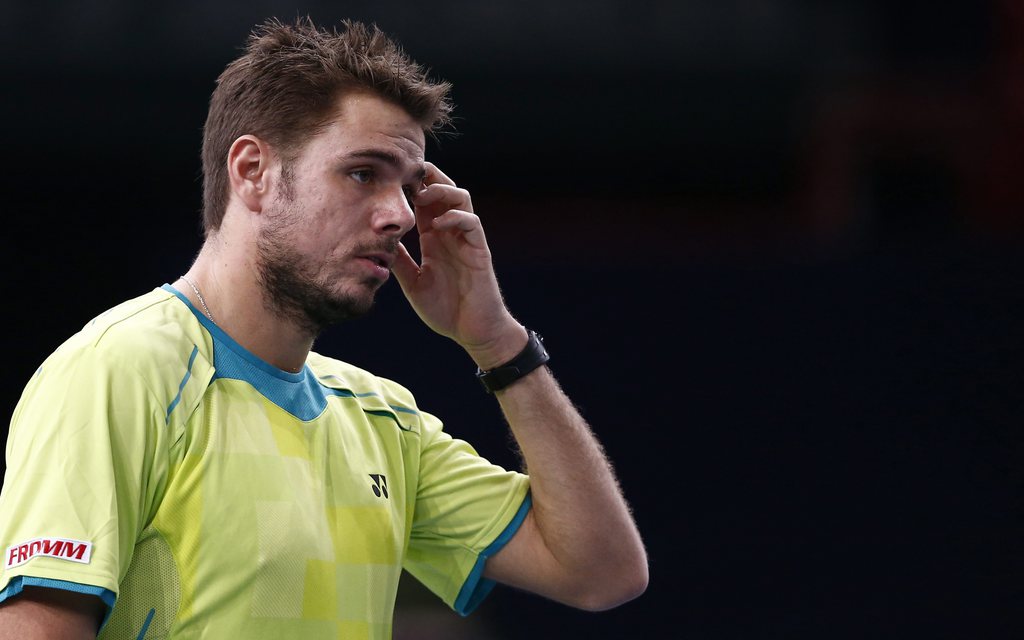 epa03454980 Stanislas Wawrinka of Switzerland reacts during his match against David Ferrer of Spain at the BNP Paribas 2012 Masters Tennis tournament in Paris, France, 01 November 2012.  EPA/IAN LANGSDON