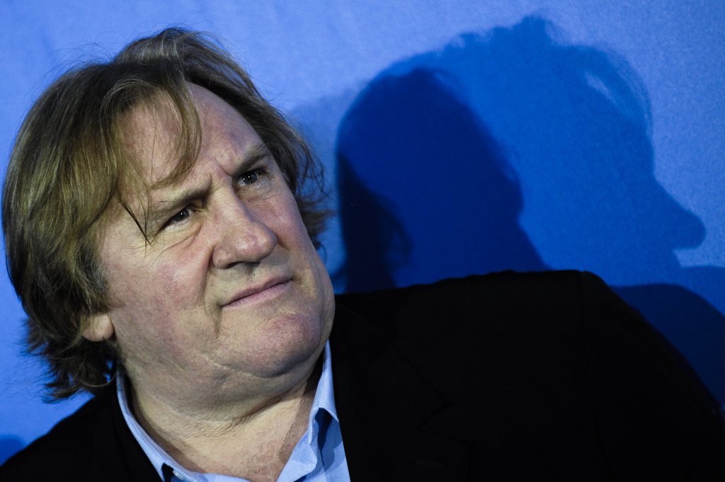 FILE - In this Friday, Feb. 19, 2010 file photo French actor Gerard Depardieu poses at a photo-call of the film 'Mammuth' in Berlin, German. A Belgian mayor said Monday Dec. 10, 2012, famed French actor Gerard Depardieu has bought a home and set up legal residence in his small town, lured by the food, the people, the lifestyle _ and lower tax rates than back home. (AP Photo/Kai-Uwe Knoth, File)