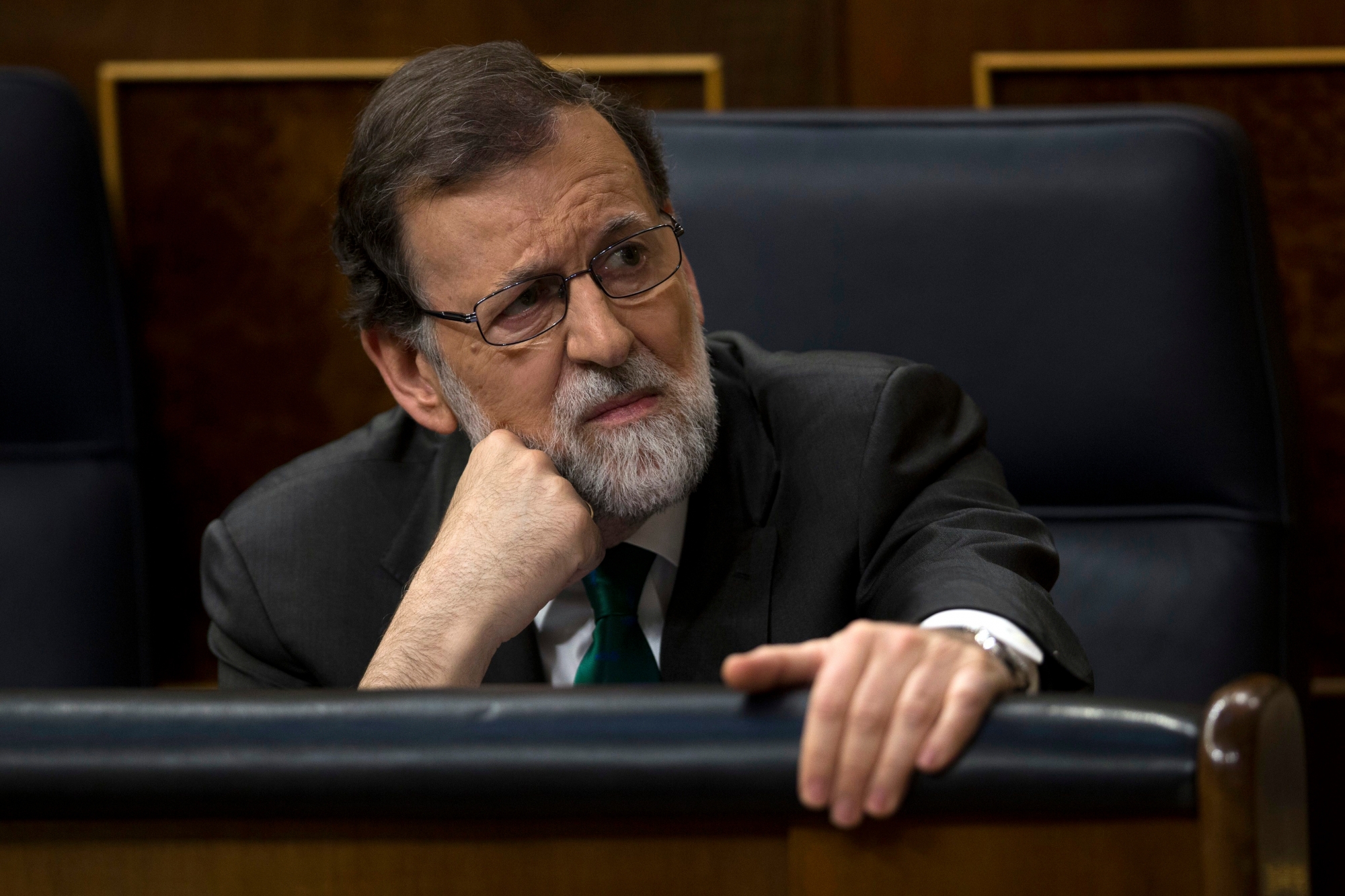 Spain's Prime Minister Mariano Rajoy and Popular Party leader listens to speeches during the first day of a motion of no confidence session at the Spanish parliament in Madrid, Thursday, May 31, 2018. The lower house of the Spanish parliament is debating whether to end Prime Minister Mariano Rajoy's close to eight years in power and supplant him with the leader of the Socialist opposition. (AP Photo/Francisco Seco) APTOPIX Spain Politics