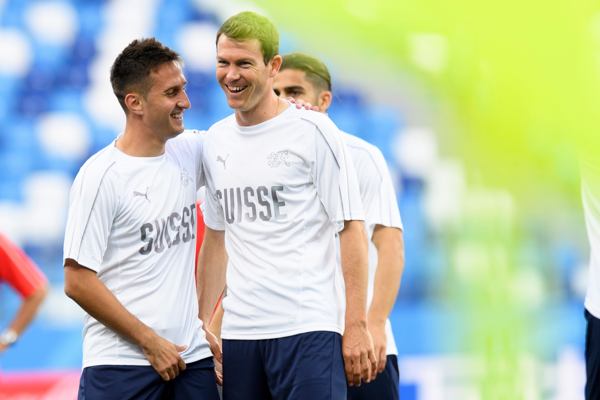 Switzerland's forward Mario Gavranovic, left, and Switzerland's defender Stephan Lichtsteiner, right, smile during a training session on the eve of the FIFA World Cup 2018 group E preliminary round soccer match between Switzerland and Costa Rica at the Nizhny Novgorod Stadium, in Nizhny Novgorod, Russia, Tuesday, June 26, 2018. (KEYSTONE/Laurent Gillieron) RUSSIA SOCCER FIFA WORLD CUP 2018 SWITZERLAND
