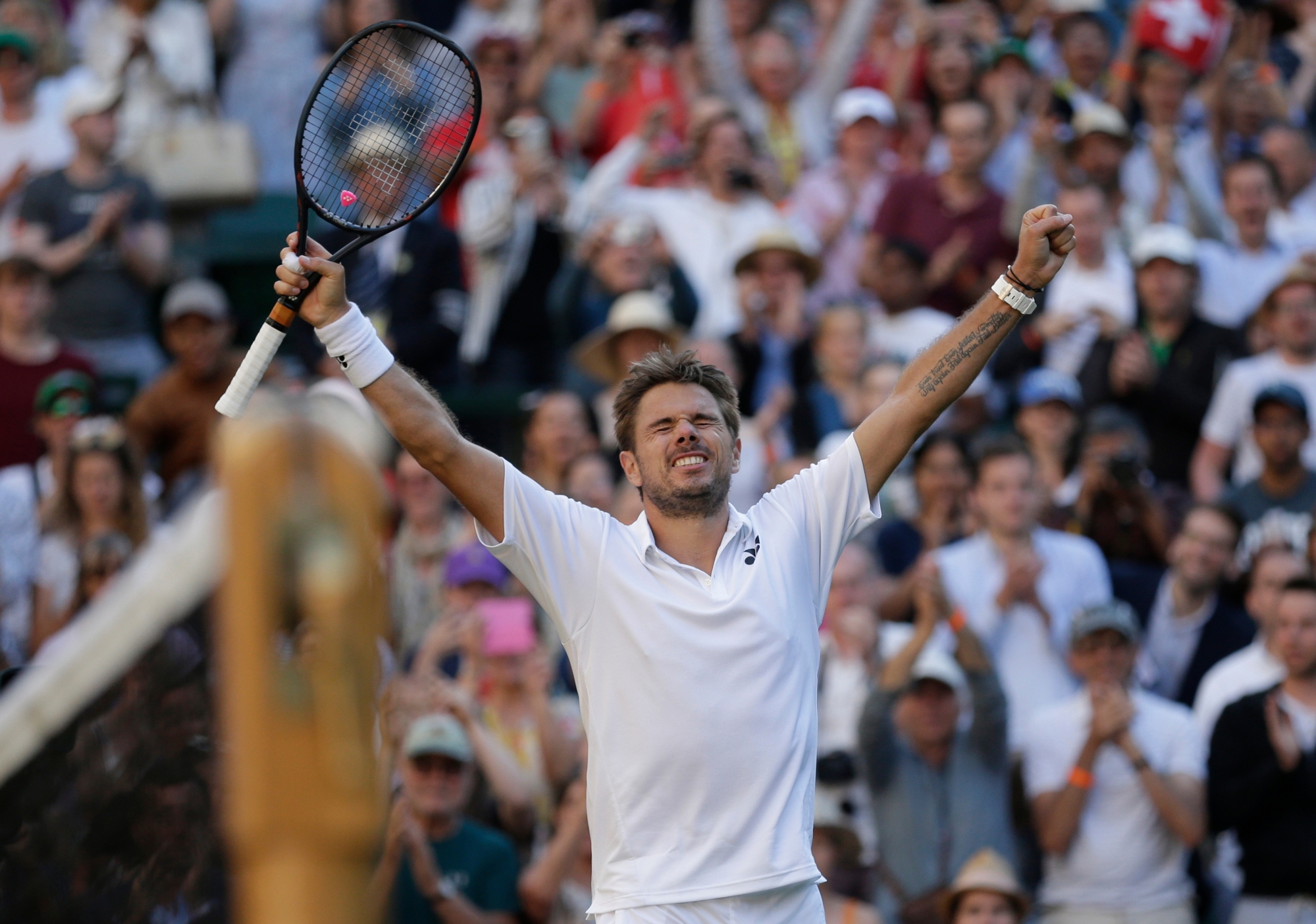 Switzerland's Stan Wawrinka celebrates victory over Grigor Dimitrov of Bulgaria, at the end of their Men's Singles first round match at the Wimbledon Tennis Championships in London, Monday July 2, 2018. (AP Photo/Tim Ireland) APTOPIX Britain Wimbledon Tennis