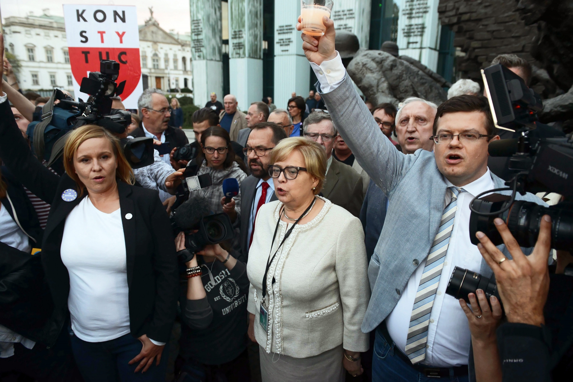 epa06863625 President of the Supreme Court Malgorzata Gersdorf (C) attends the demonstration, organized by opponents of the judicial reform in front of the seat of the Supreme Court in Warsaw, Poland, 03 July 2018 (issued 04 July 2018). The protesters are opposed to the amendment of the Act on the Supreme Court, according to which judges who turned 65 are retired. The retirement of Supreme Court First President Malgorzata Gersdorf is in line with binding laws, presidential aide Pawel Mucha argued on 03 July after a meeting attended among others by President Andrzej Duda and Gersdorf.  EPA/JAKUB KAMINSKI POLAND OUT POLAND PROTEST JUDICIARY